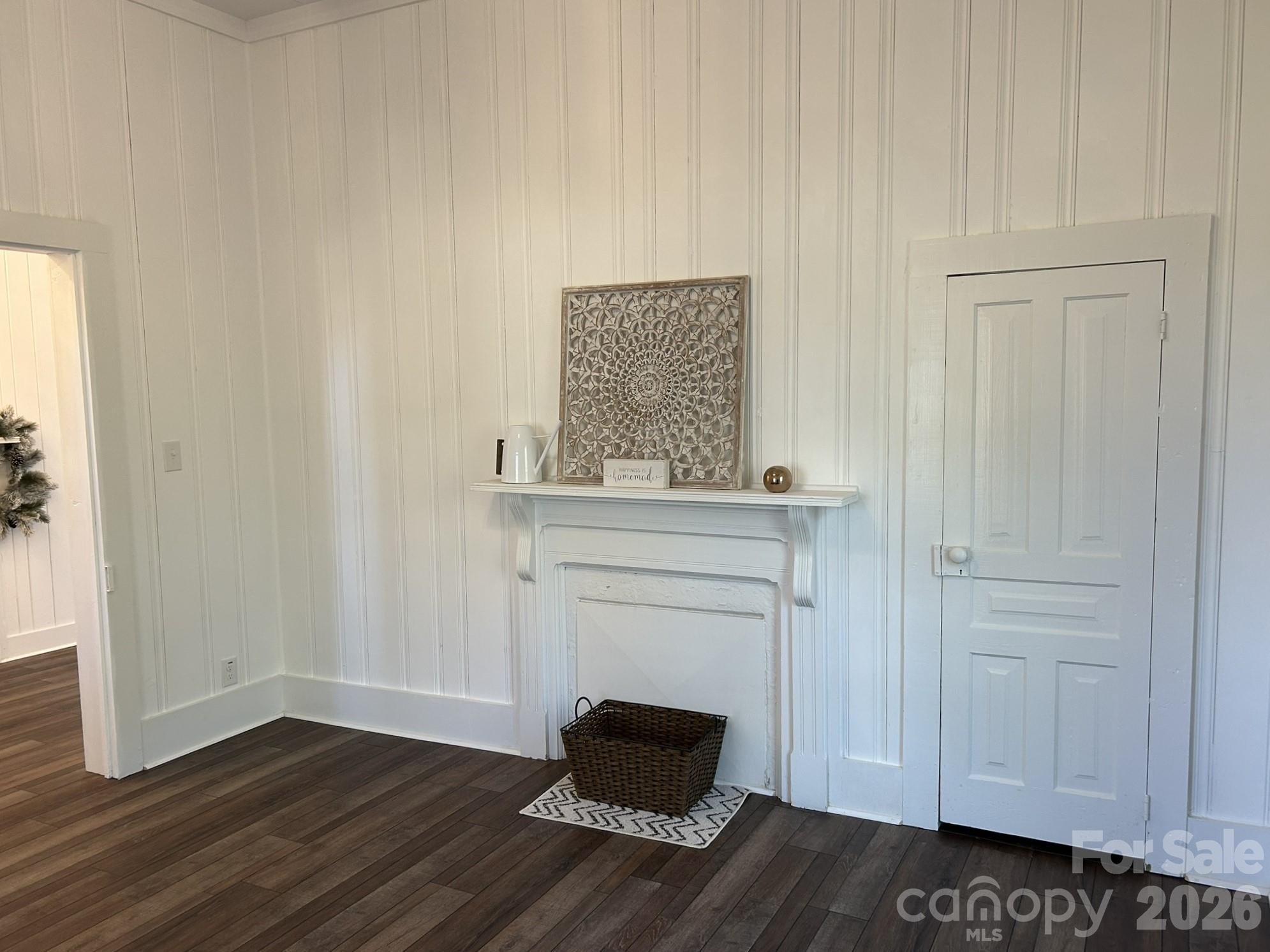 464 Hamrick Road Mooresboro, NC 28114 - Photo 36 of 47 a room with a mirror and a wooden floor