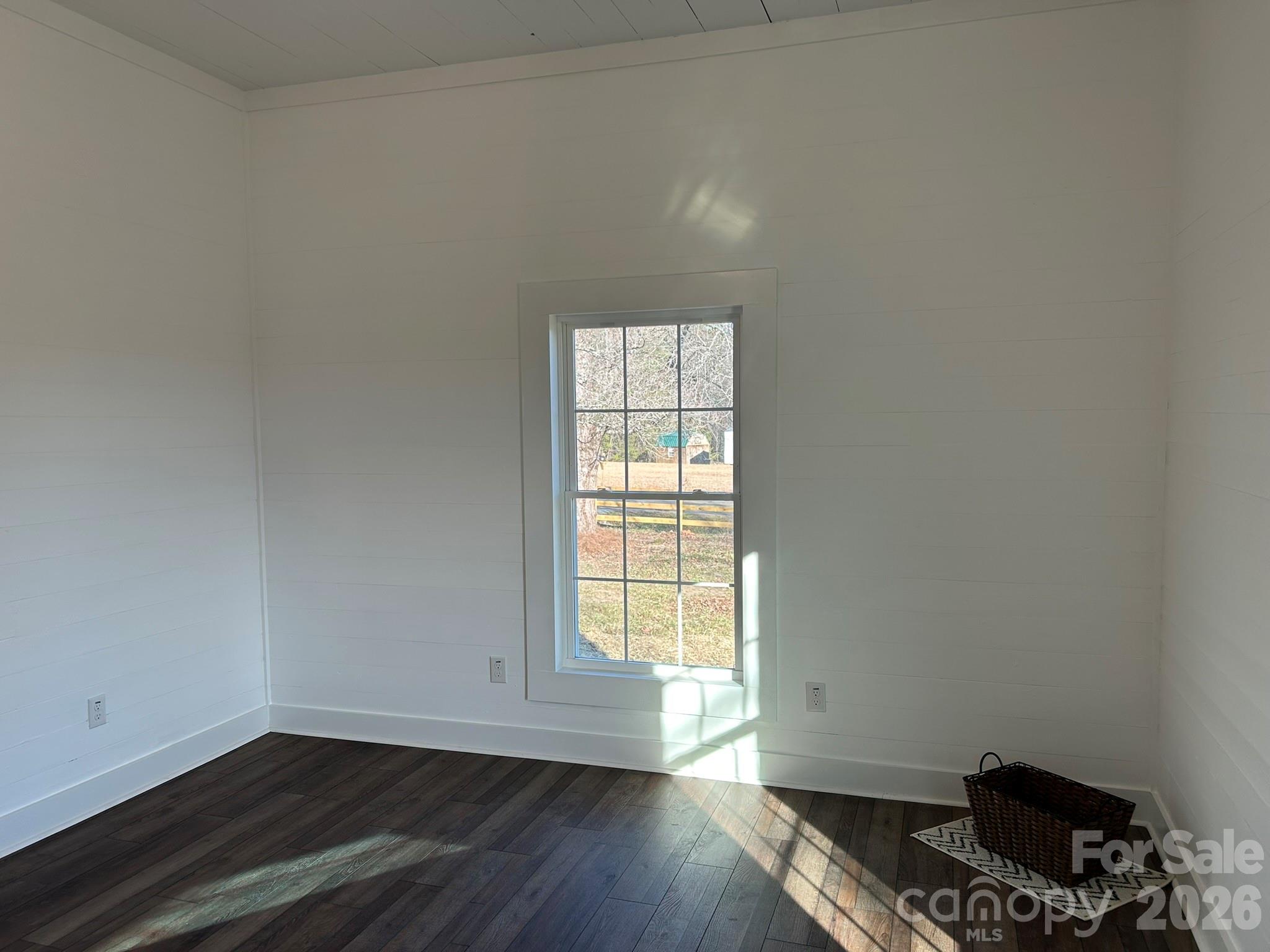 464 Hamrick Road Mooresboro, NC 28114 - Photo 38 of 47 a view of an empty room with wooden floor and a window