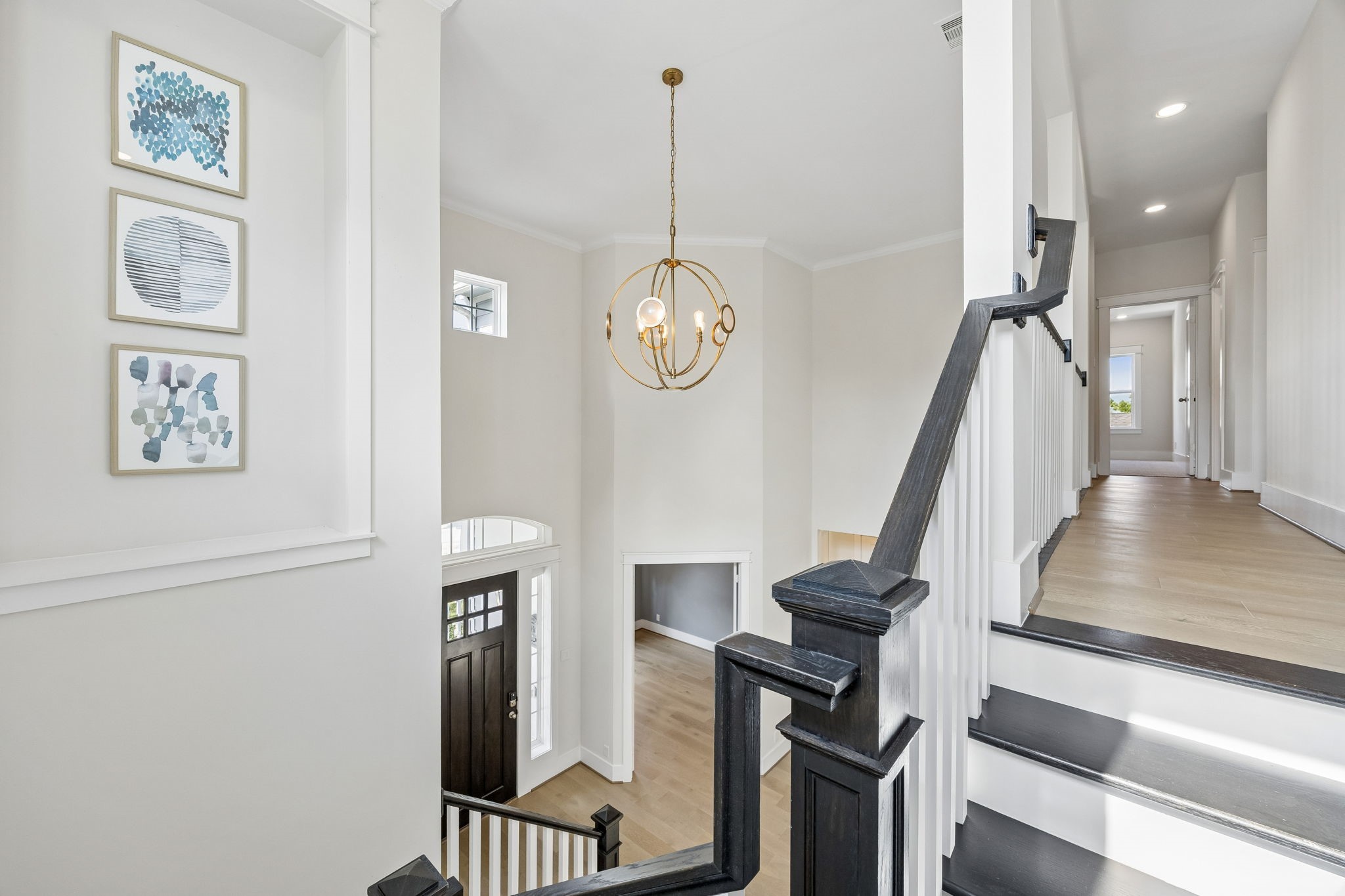 8558 Ridgepoint Drive Houston, TX 77055 - Photo 18 of 39 Tall windows and an open volume emphasize the living room's natural light and dramatic proportions.