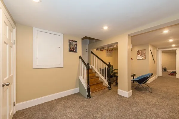 a view of an entryway with wooden floor