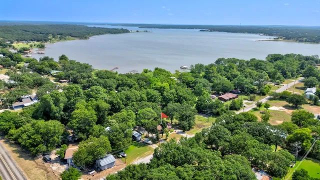 a view of a lake with beach and mountain view