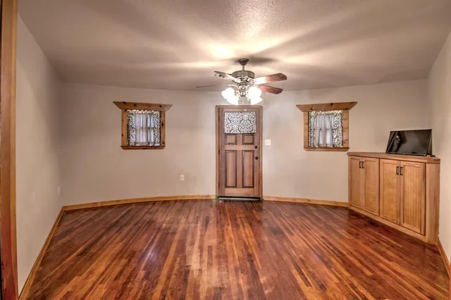 a view of a livingroom with wooden floor