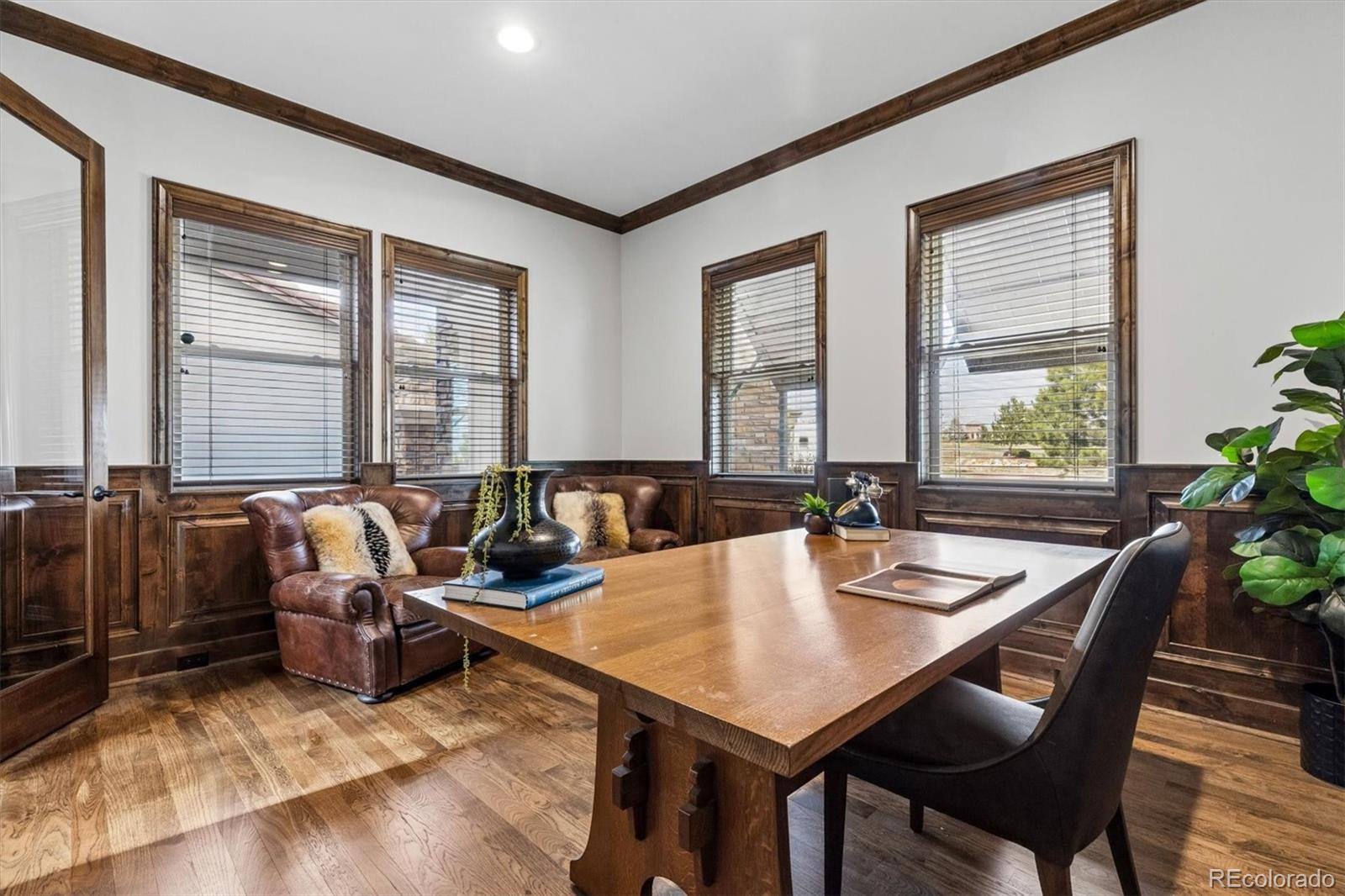 4698 Bandera Place Parker, CO 80134 - Photo 21 of 43 a view of a dining room with furniture window and wooden floor