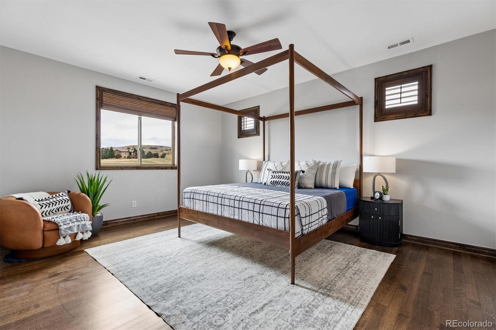 4698 Bandera Place Parker, CO 80134 - Photo 25 of 43 a bedroom with a bed and windows