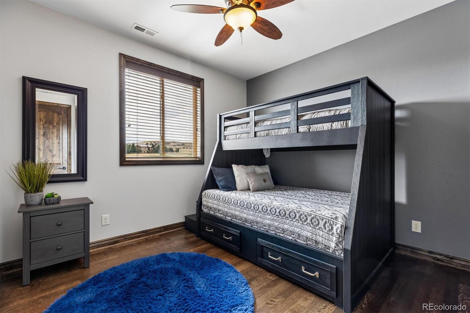 4698 Bandera Place Parker, CO 80134 - Photo 28 of 43 a bedroom with a bed and a window