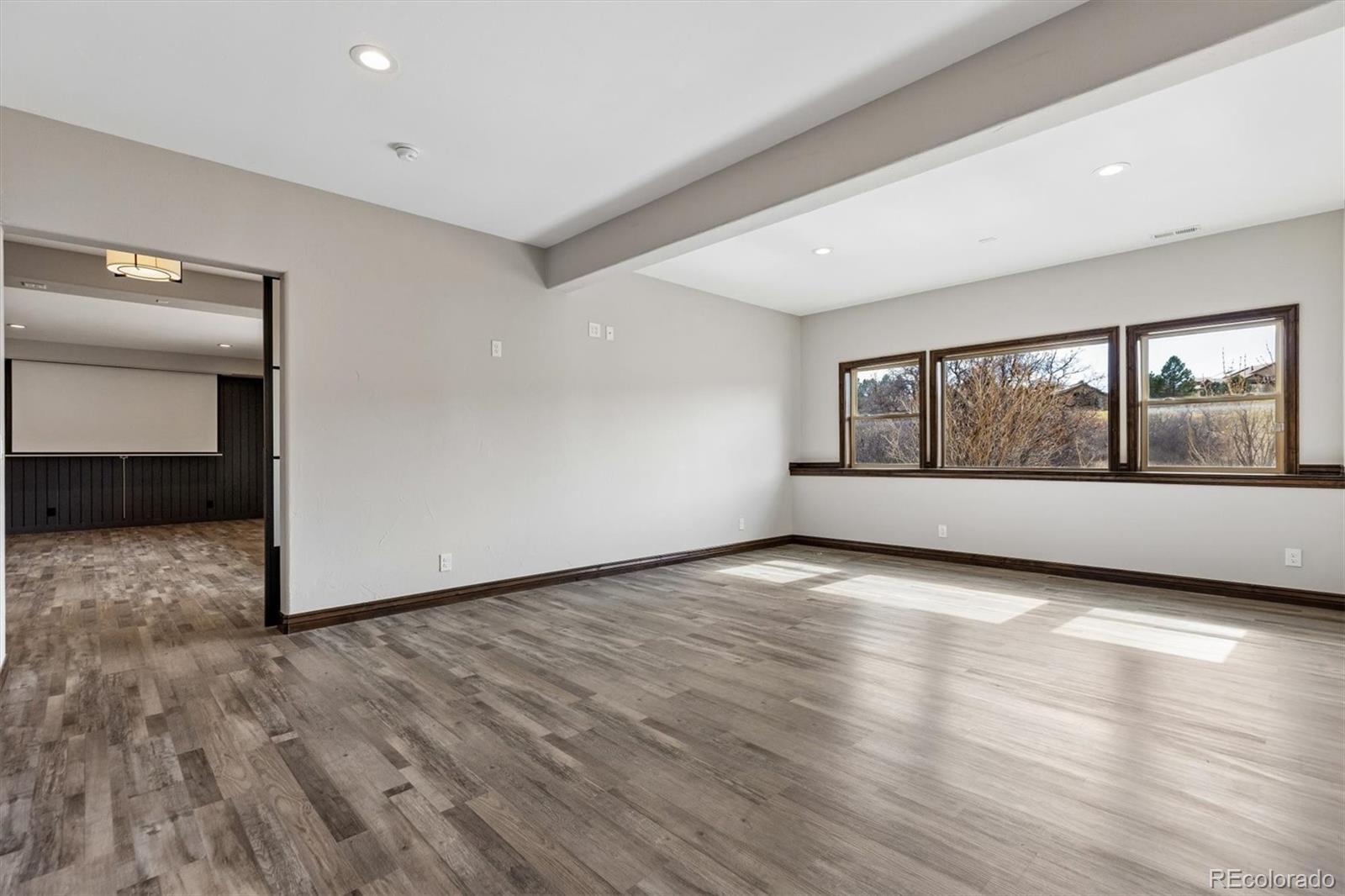 4698 Bandera Place Parker, CO 80134 - Photo 37 of 43 wooden floor in an empty room with a window