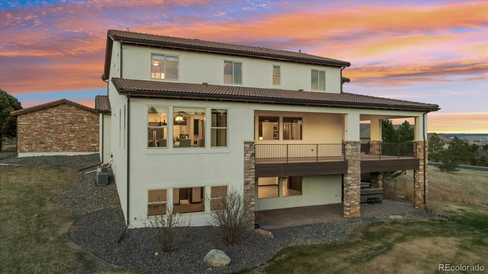 4698 Bandera Place Parker, CO 80134 - Photo 40 of 43 a front view of a house with a balcony