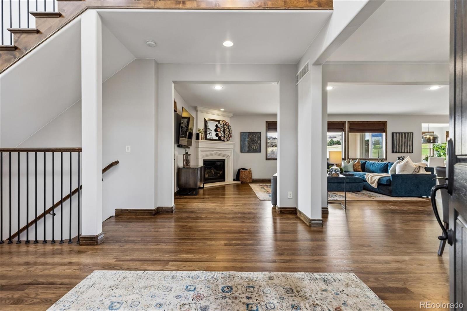 4698 Bandera Place Parker, CO 80134 - Photo 5 of 43 a view of a living room and kitchen view