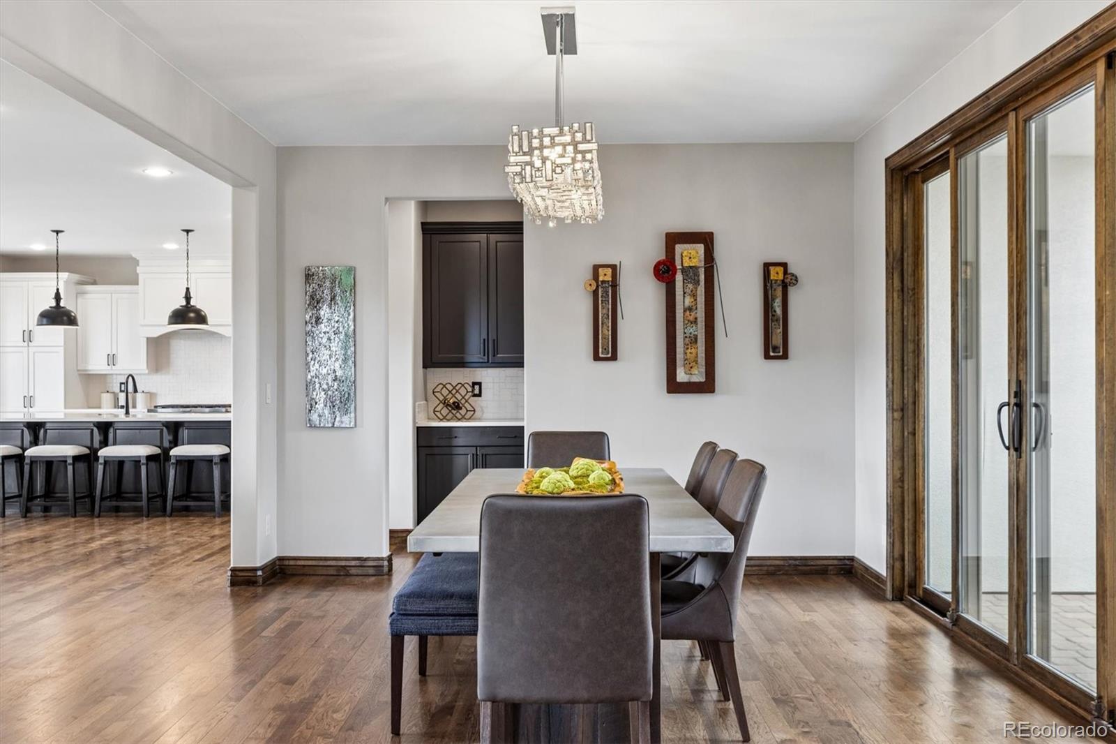 4698 Bandera Place Parker, CO 80134 - Photo 7 of 43 a view of a dining room with furniture window and wooden floor