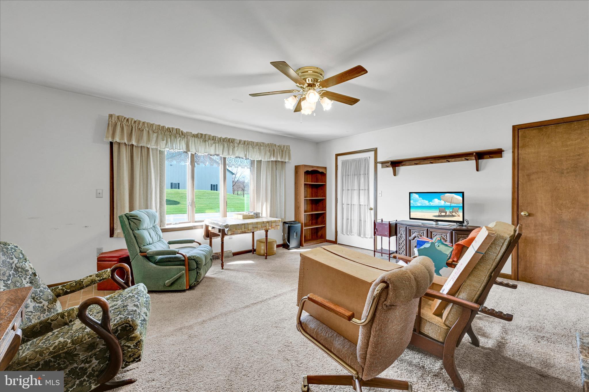 91 Williams Road Myerstown, PA 17067 - Photo 8 of 40 a living room with furniture a window and a flat screen tv