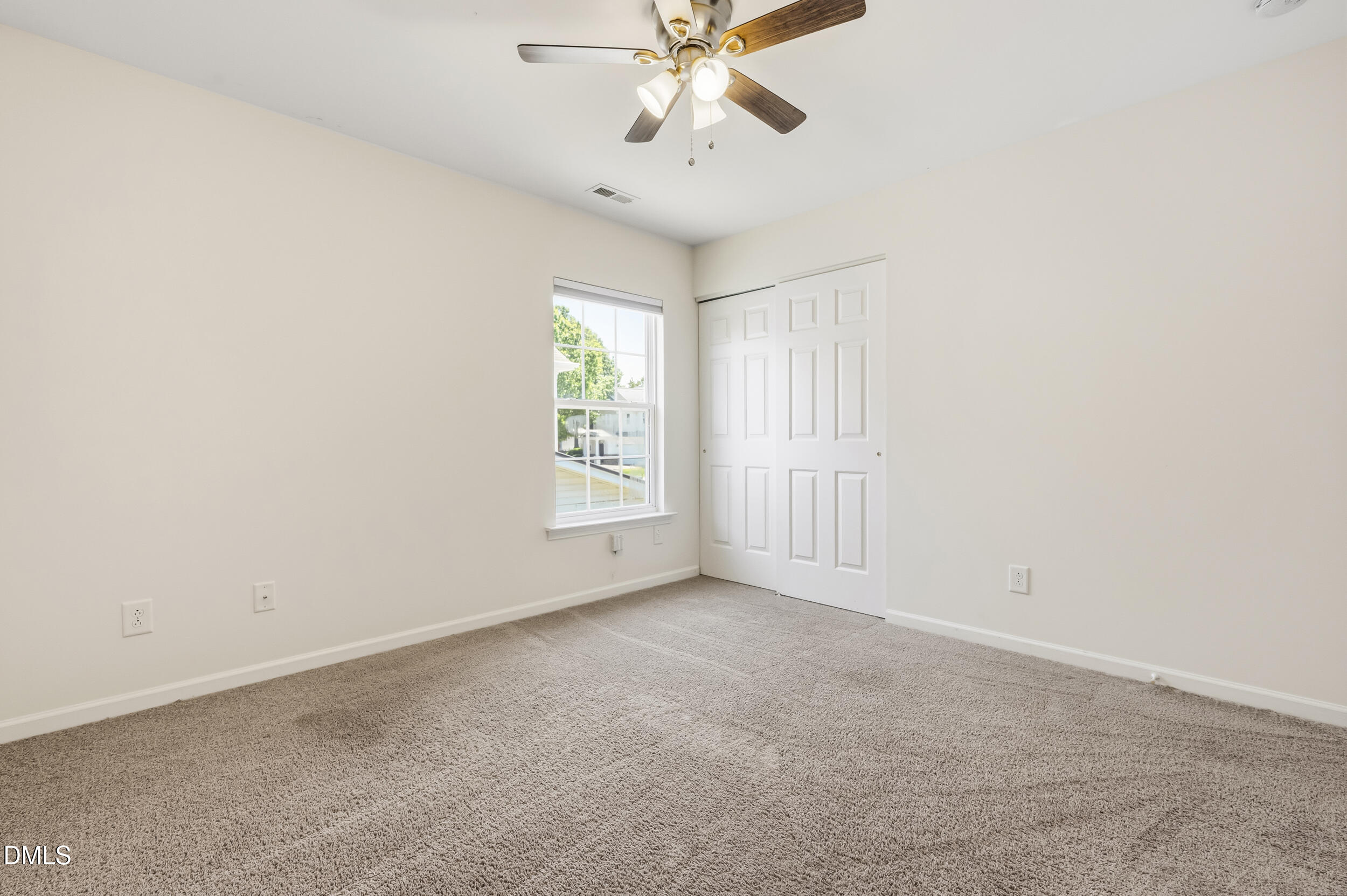 112 Ryder Cup Circle Raleigh, NC 27603 - Photo 21 of 45 an empty room with windows and fan