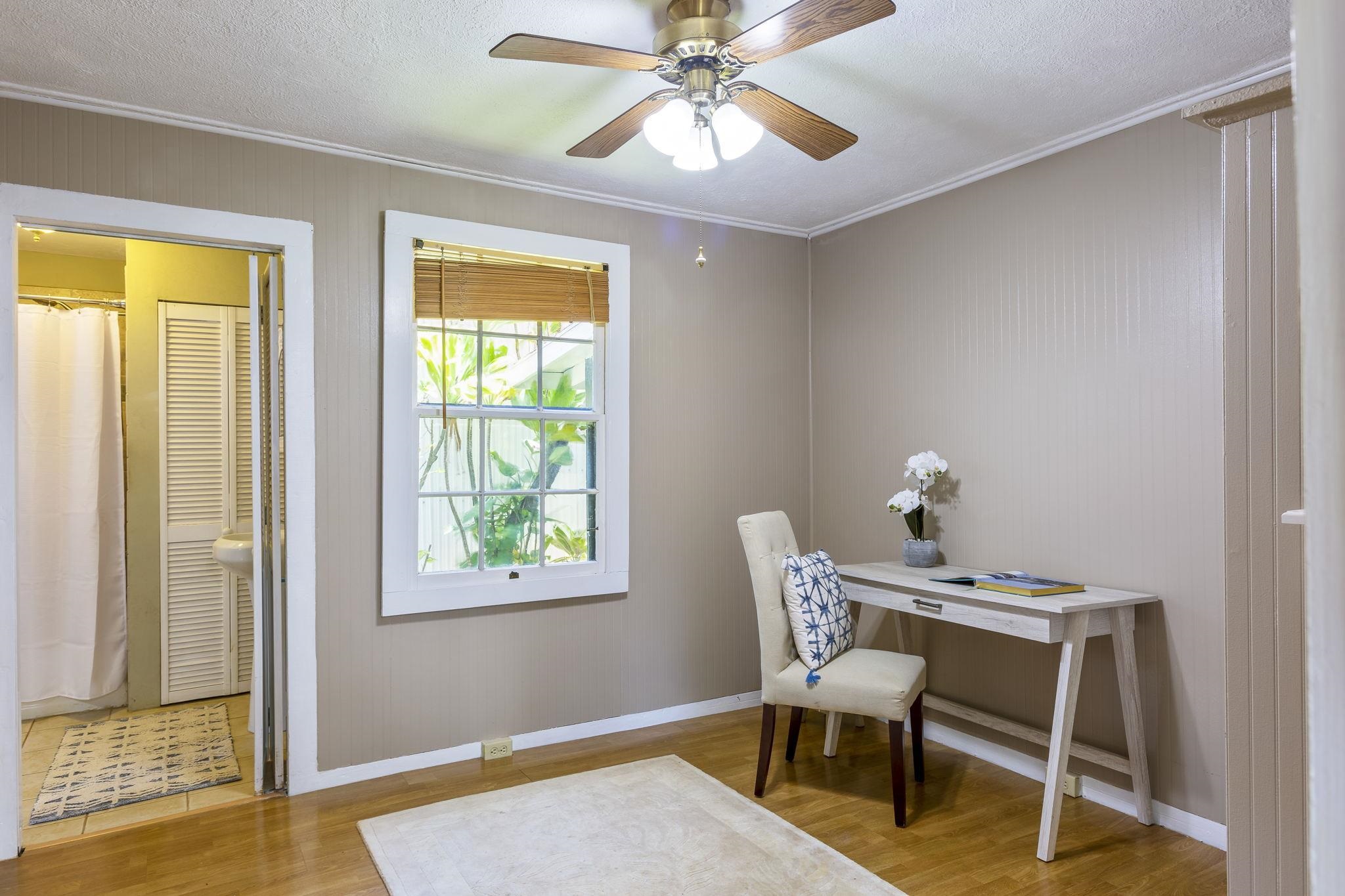 815 Kuulei Street Haiku, HI 96708 - Photo 11 of 25 a workspace with wooden floor and a window