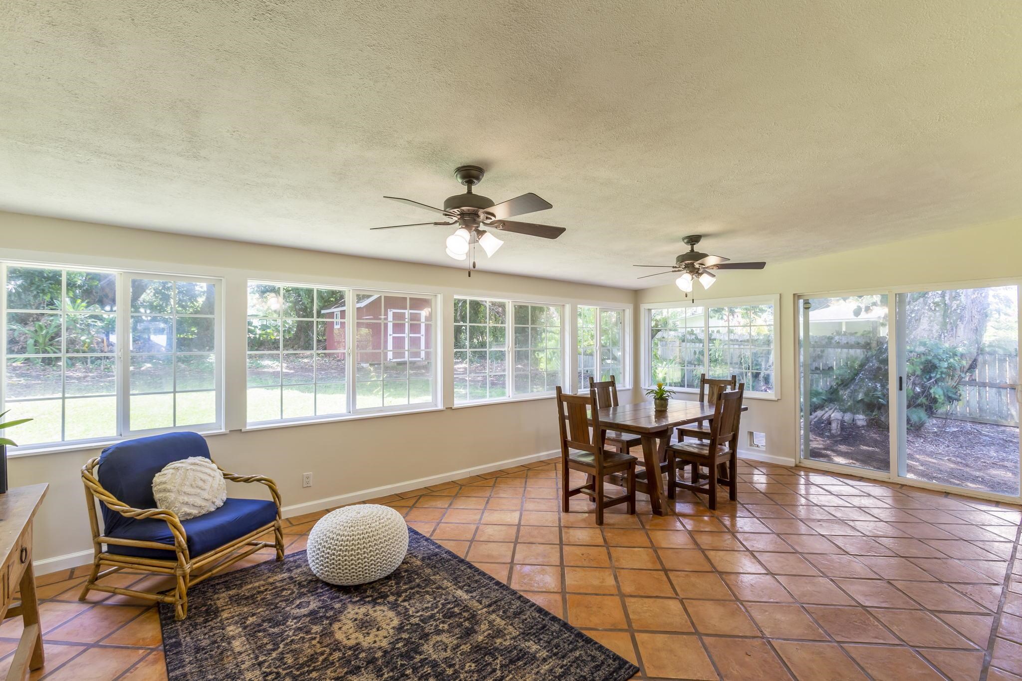 815 Kuulei Street Haiku, HI 96708 - Photo 12 of 25 a living room with furniture and a large window