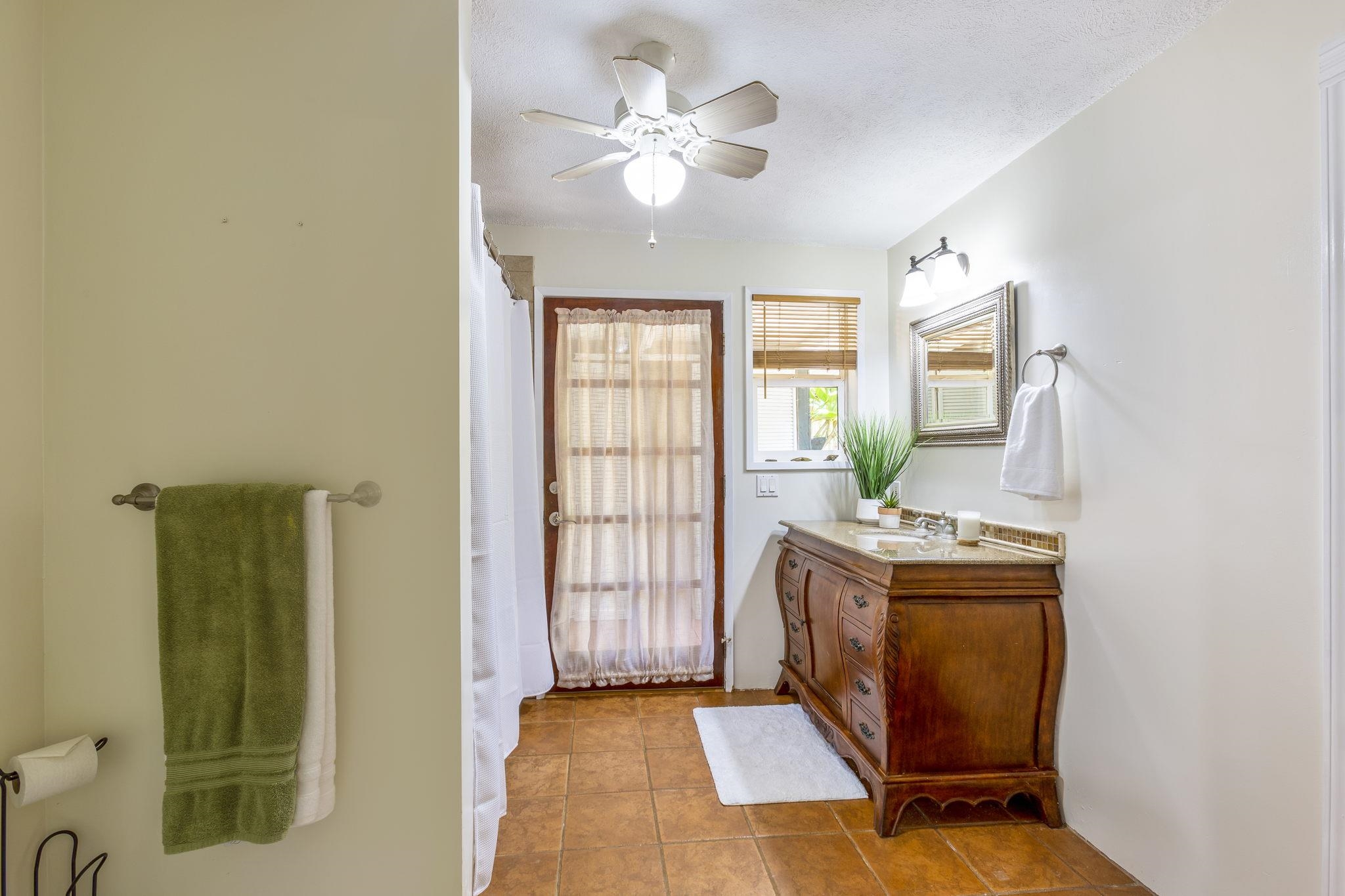 815 Kuulei Street Haiku, HI 96708 - Photo 15 of 25 a living room with furniture and a chandelier
