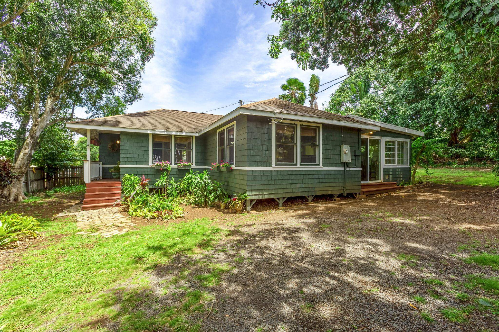 815 Kuulei Street Haiku, HI 96708 - Photo 20 of 25 a front view of a house with a yard