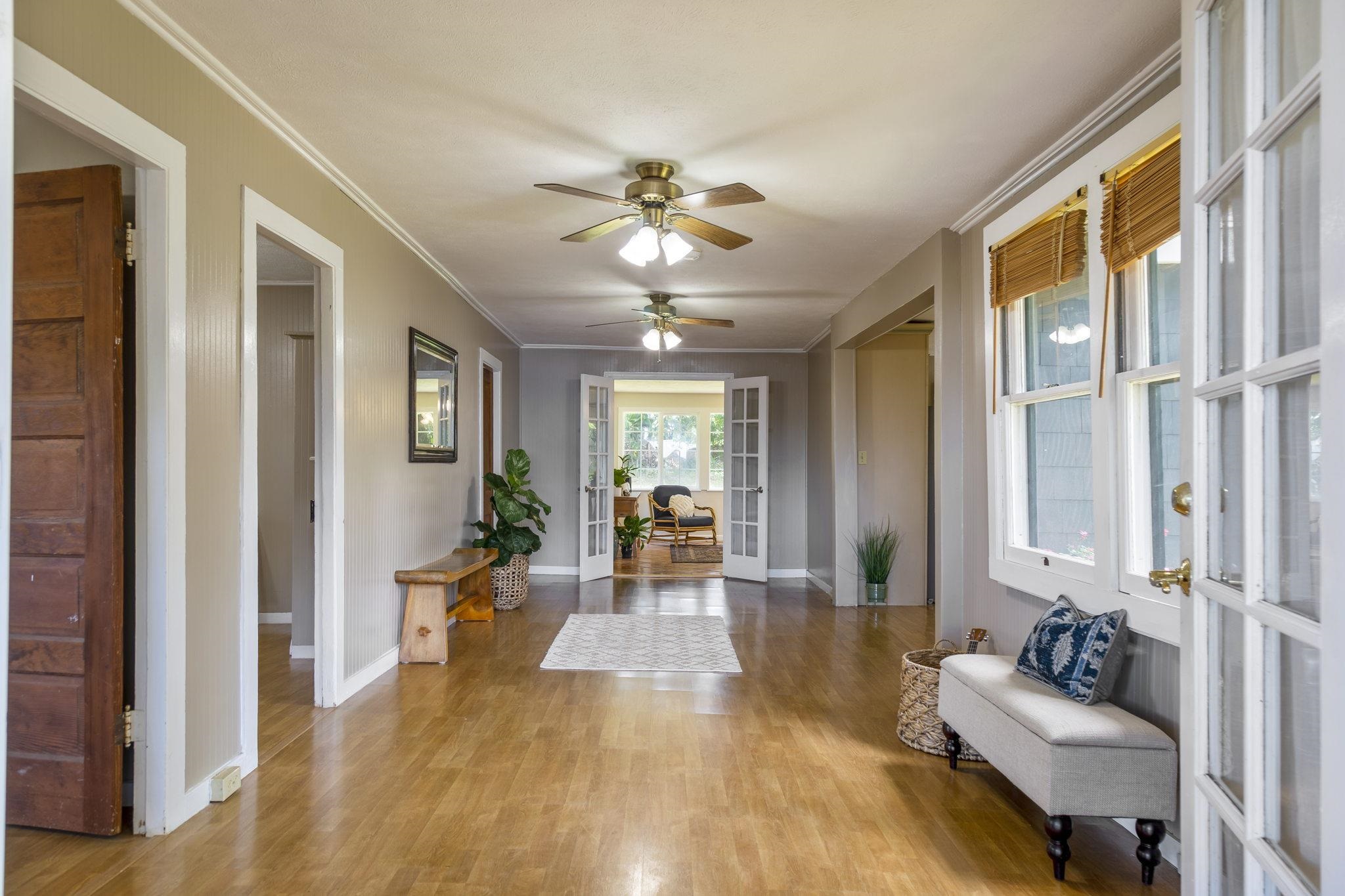 815 Kuulei Street Haiku, HI 96708 - Photo 2 of 25 a living room with furniture and a chandelier