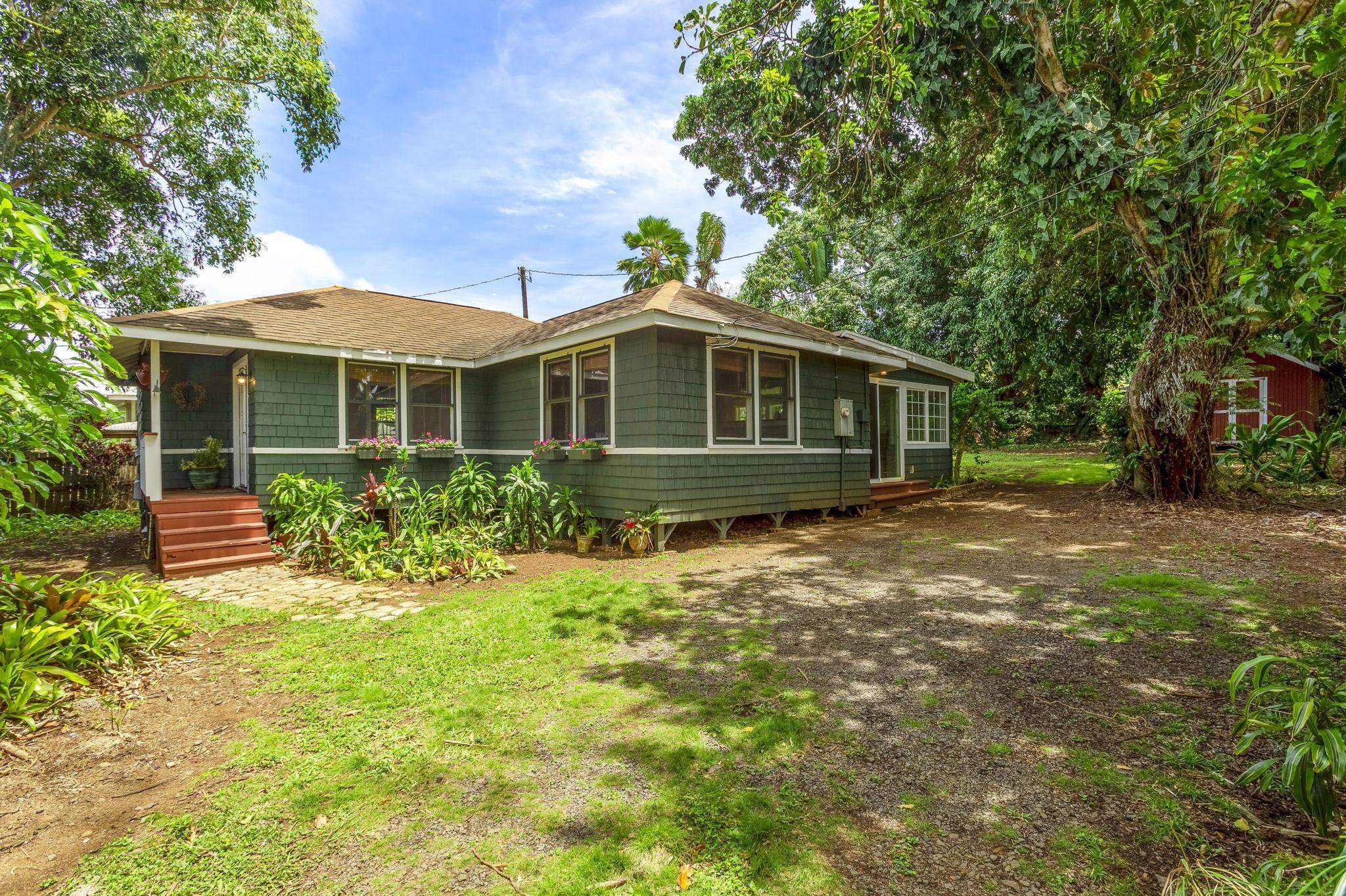 815 Kuulei Street Haiku, HI 96708 - Photo 24 of 25 a front view of a house with a yard