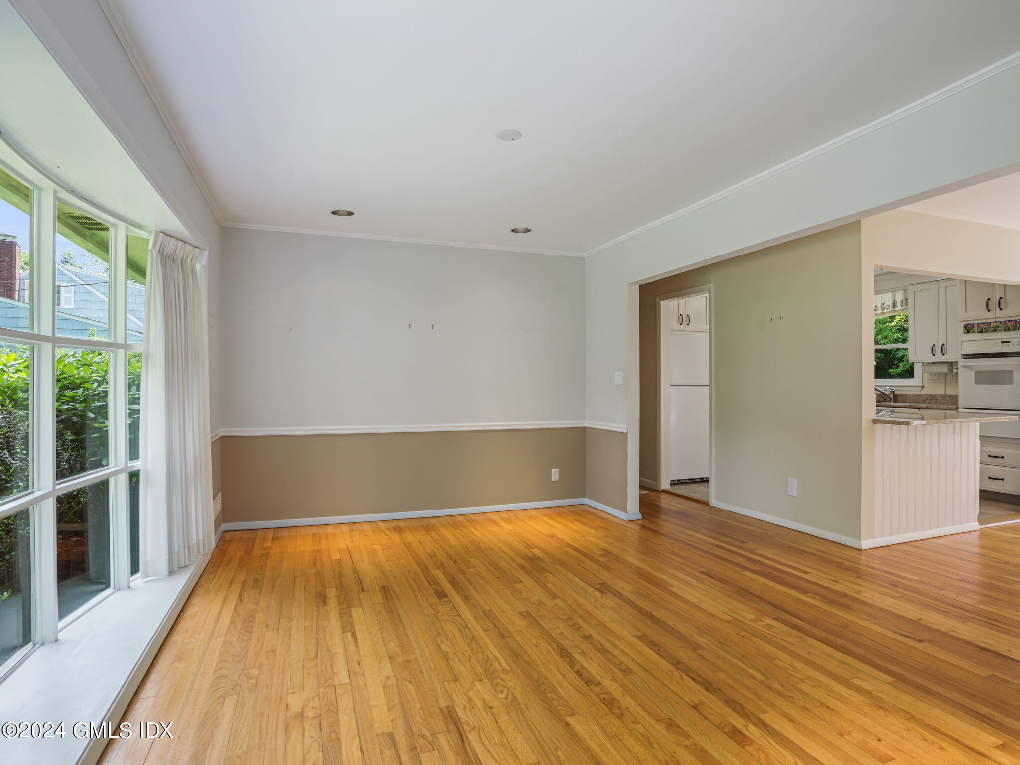 28 Dandy Drive Cos Cob, CT 06807 - Photo 15 of 35 a view of a big room with wooden floor and windows