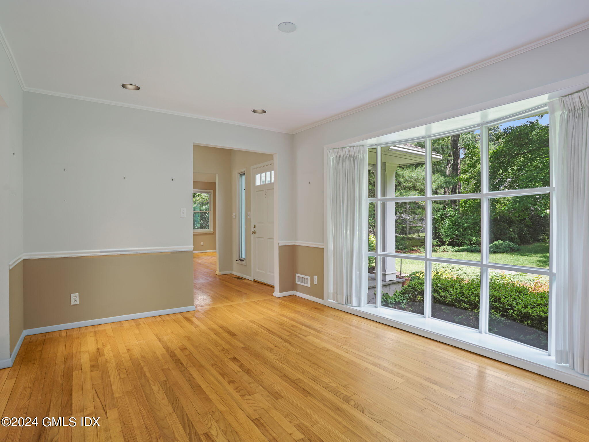 28 Dandy Drive Cos Cob, CT 06807 - Photo 16 of 35 a view of an empty room with wooden floor and a window