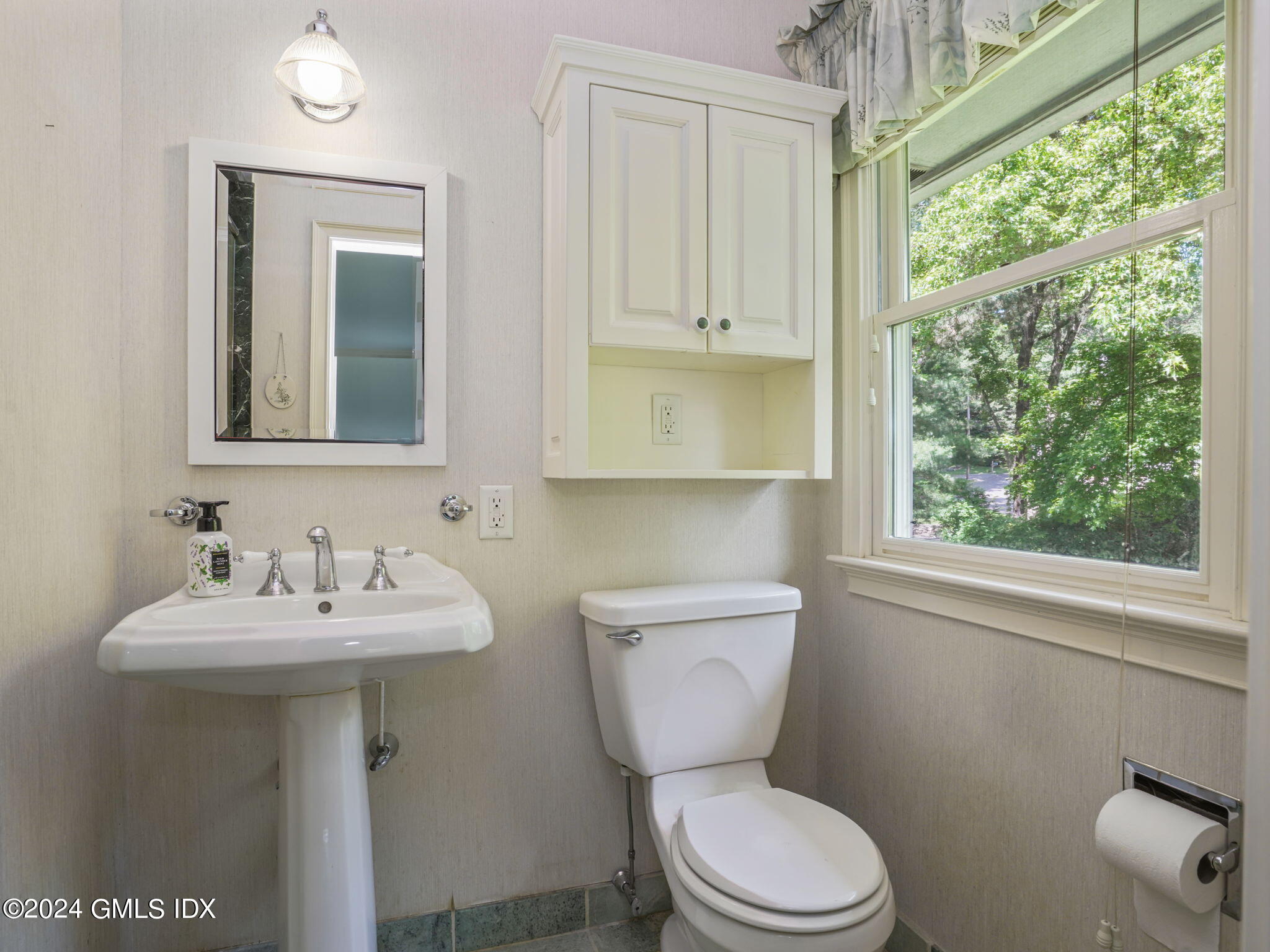 28 Dandy Drive Cos Cob, CT 06807 - Photo 19 of 35 a bathroom with a toilet sink and mirror