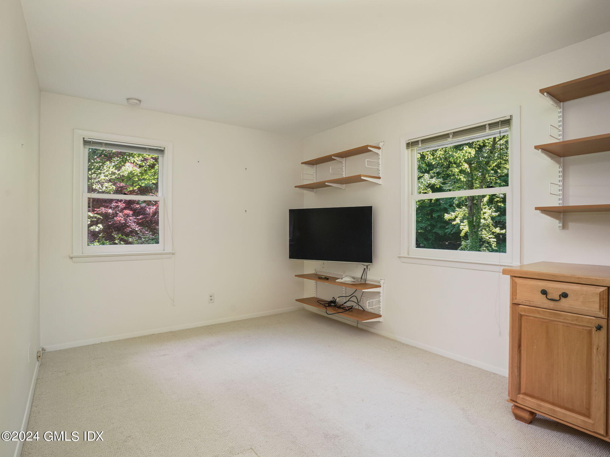 28 Dandy Drive Cos Cob, CT 06807 - Photo 20 of 35 a view of a livingroom with furniture and a window