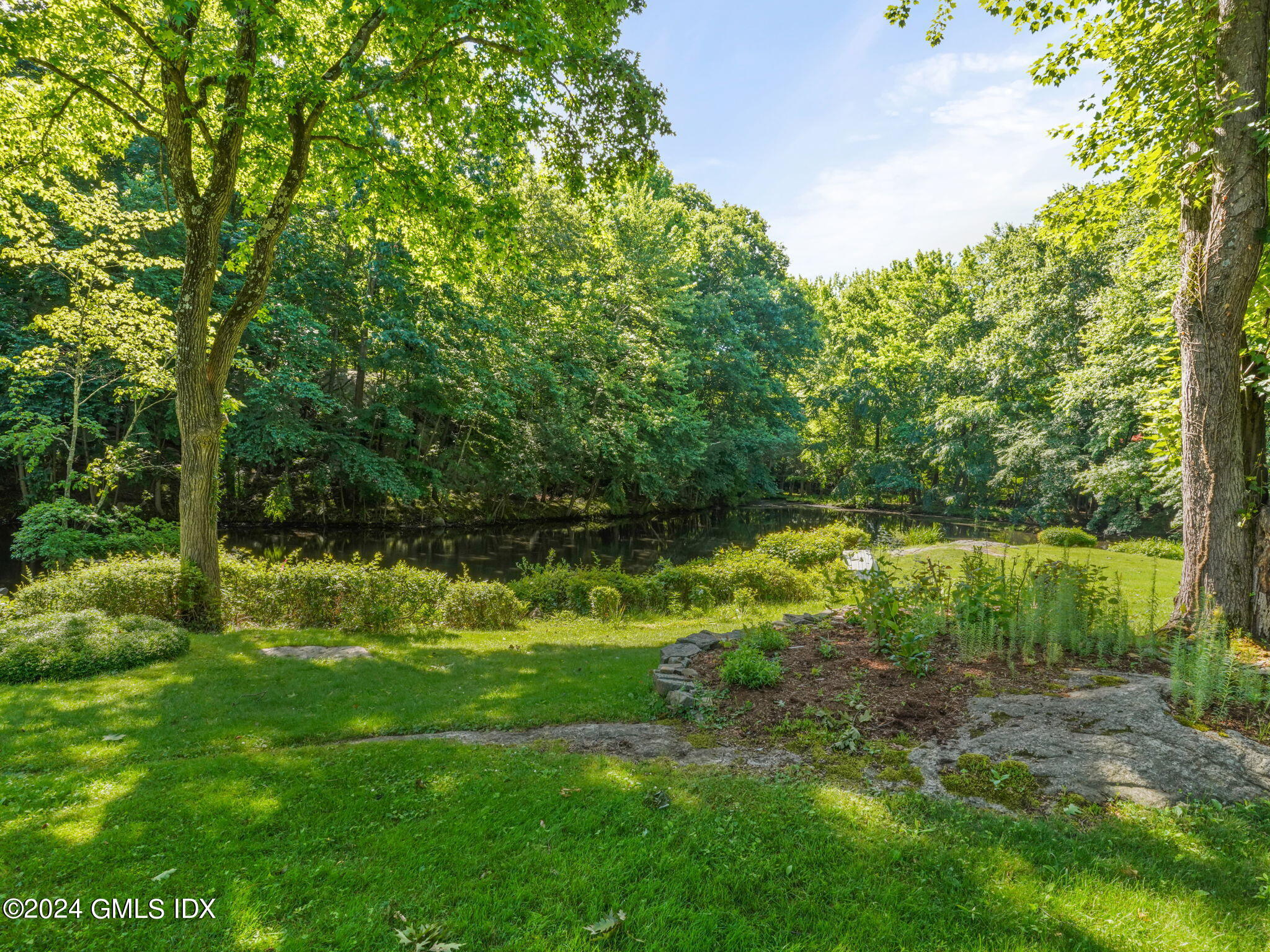 28 Dandy Drive Cos Cob, CT 06807 - Photo 2 of 35 a view of a yard with a tree
