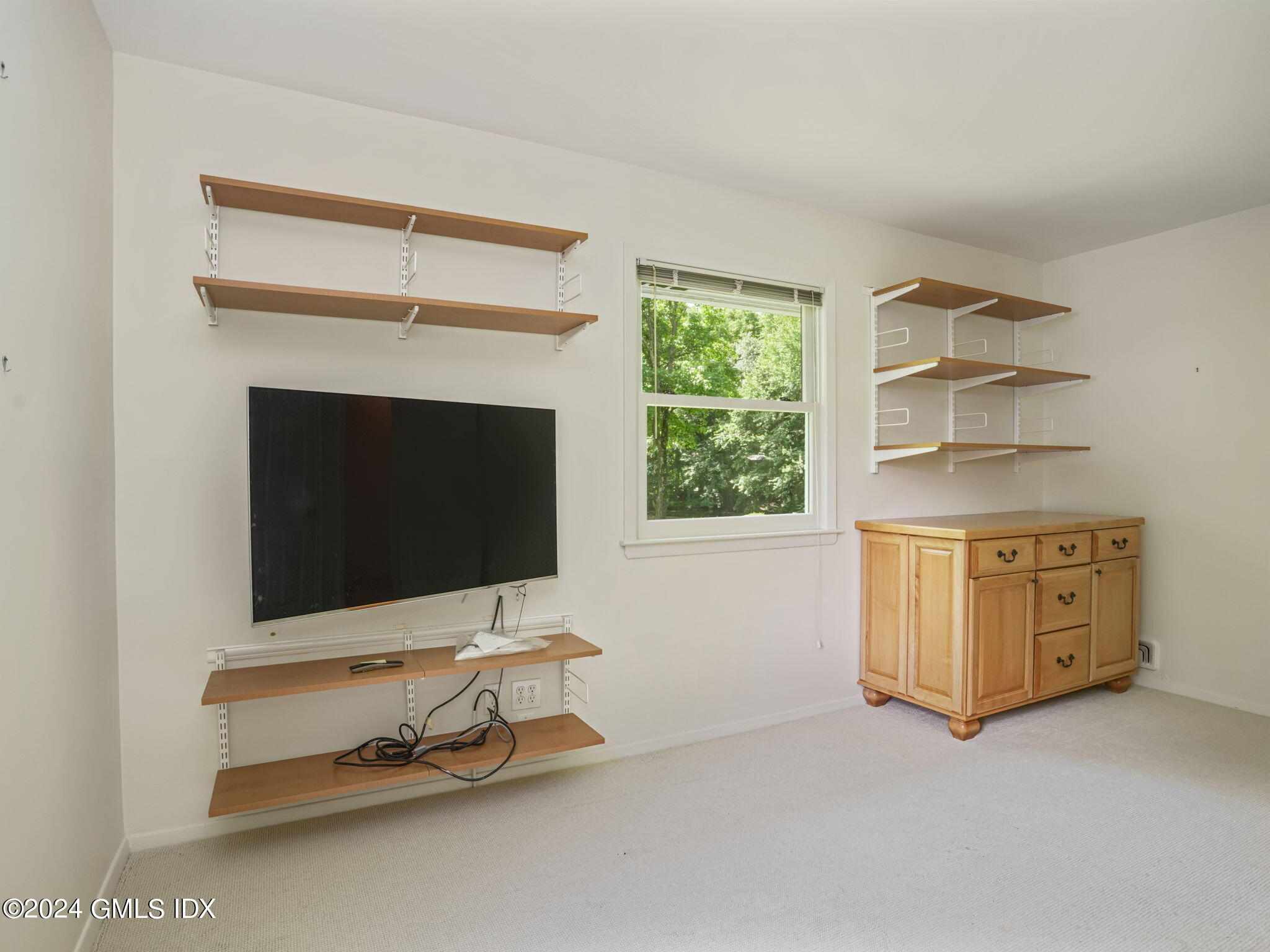 28 Dandy Drive Cos Cob, CT 06807 - Photo 21 of 35 a room with furniture and flat screen tv