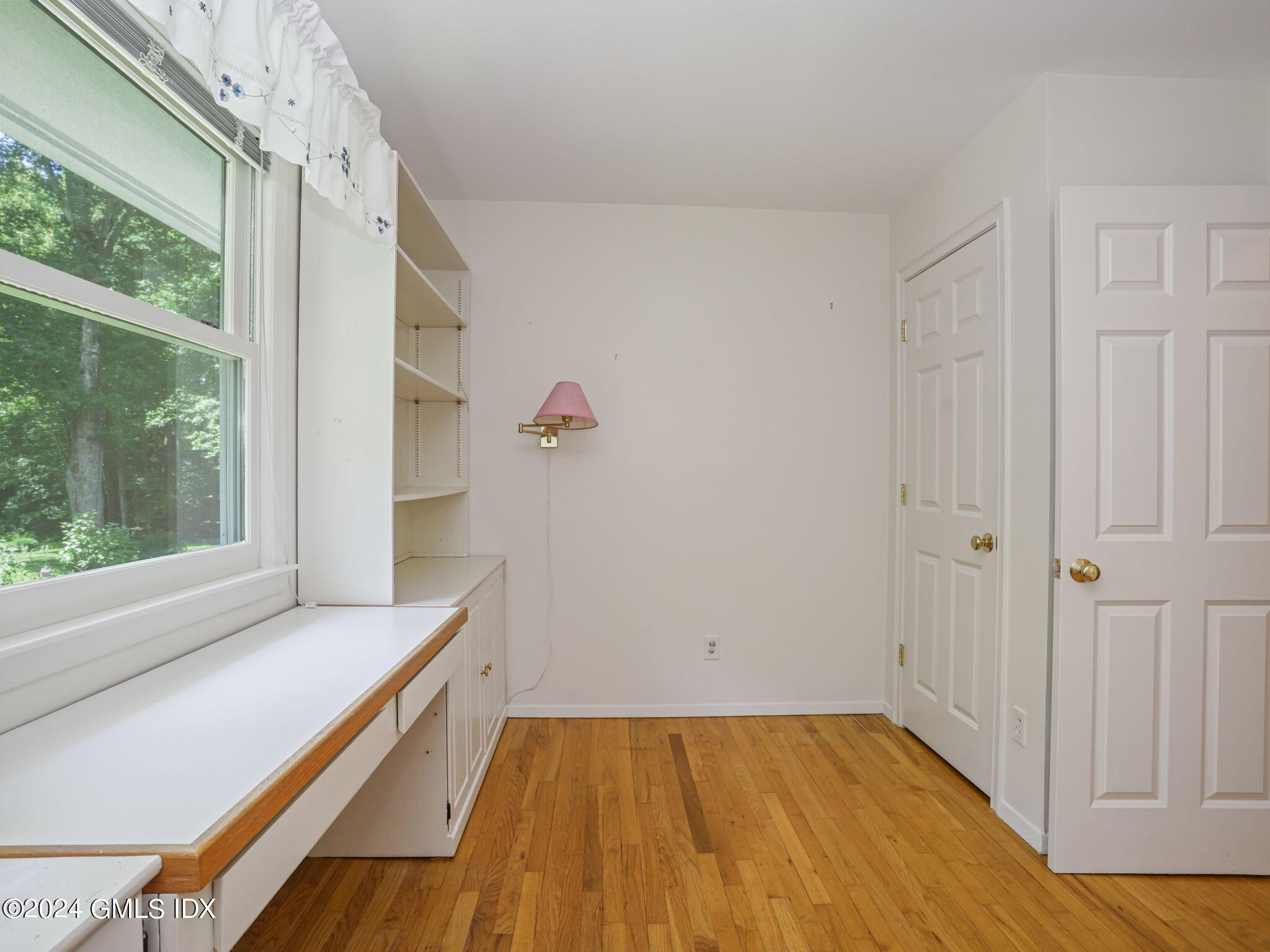 28 Dandy Drive Cos Cob, CT 06807 - Photo 22 of 35 a view of a room with wooden floor and windows