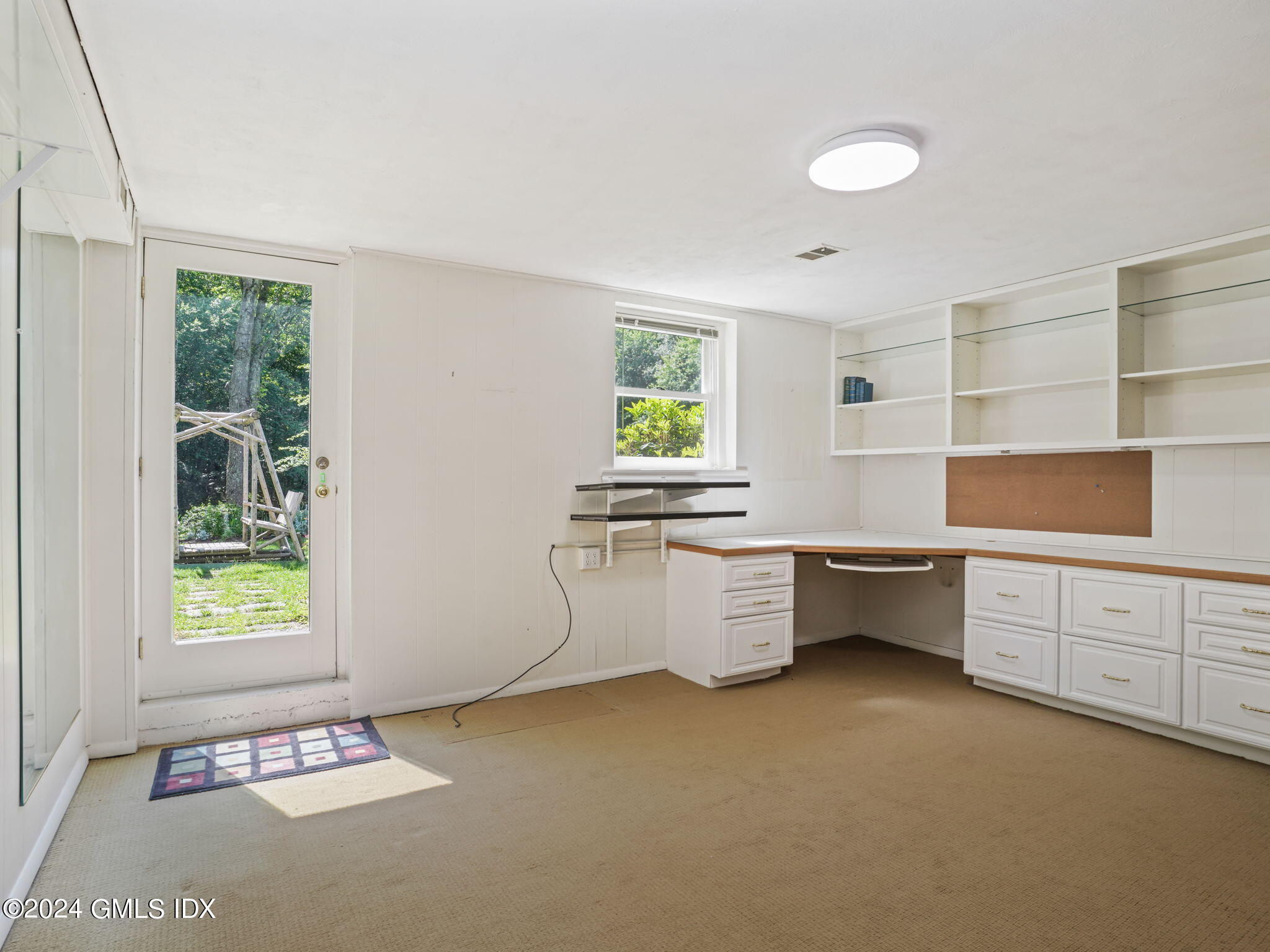 28 Dandy Drive Cos Cob, CT 06807 - Photo 25 of 35 a kitchen with sink cabinets and window