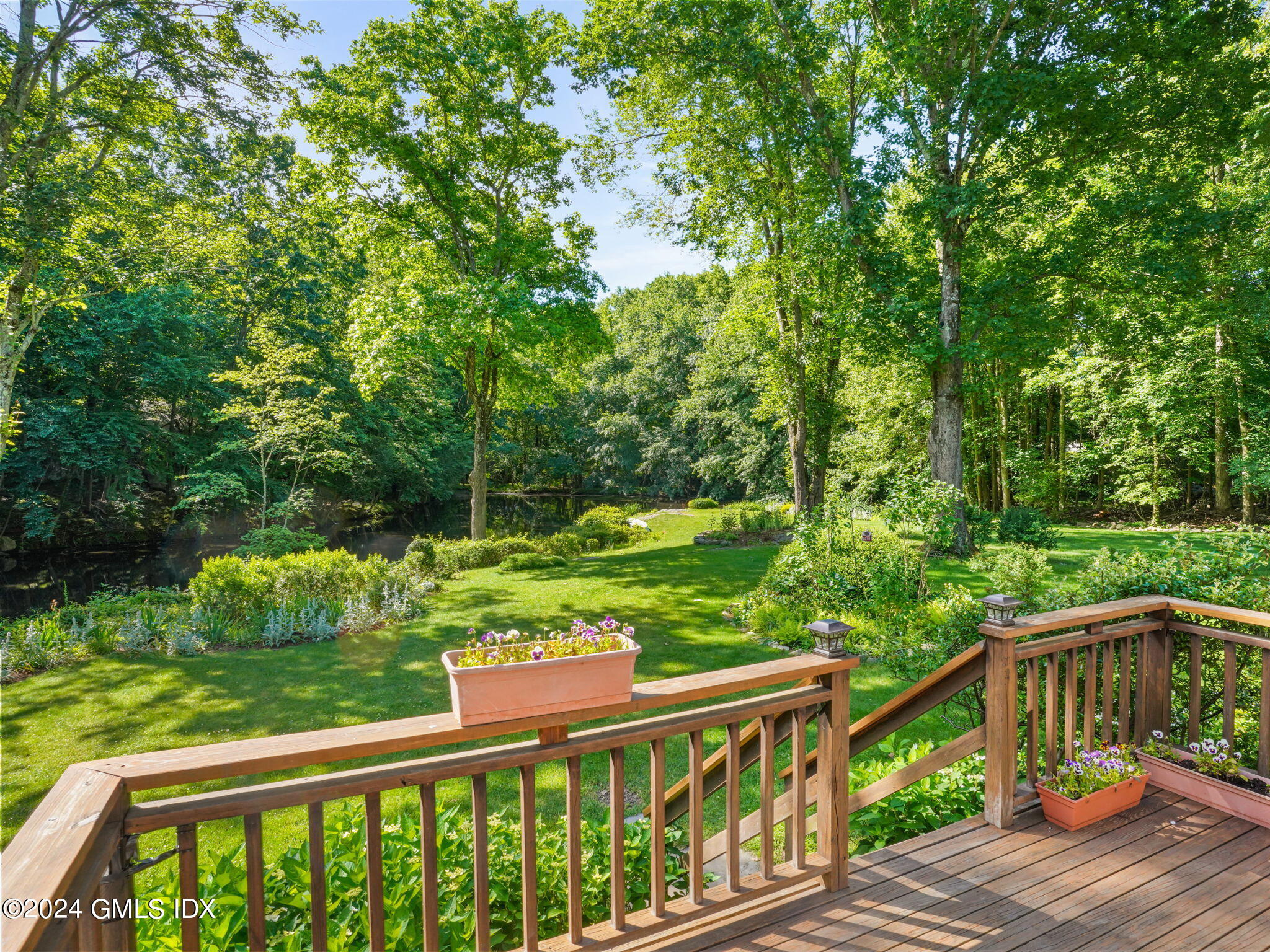 28 Dandy Drive Cos Cob, CT 06807 - Photo 29 of 35 a view of a wooden deck with a yard