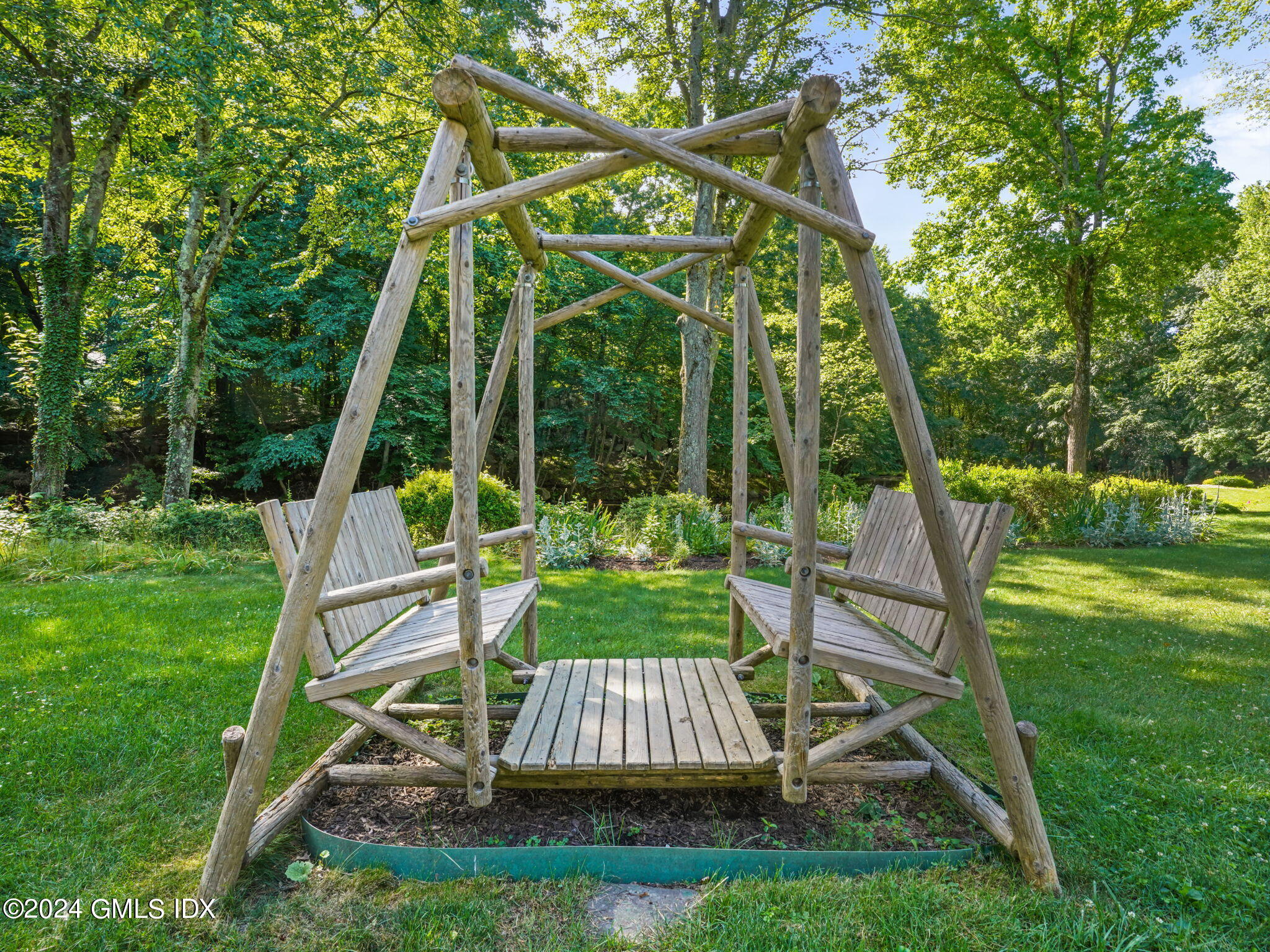 28 Dandy Drive Cos Cob, CT 06807 - Photo 30 of 35 a view of a chair and table in the garden