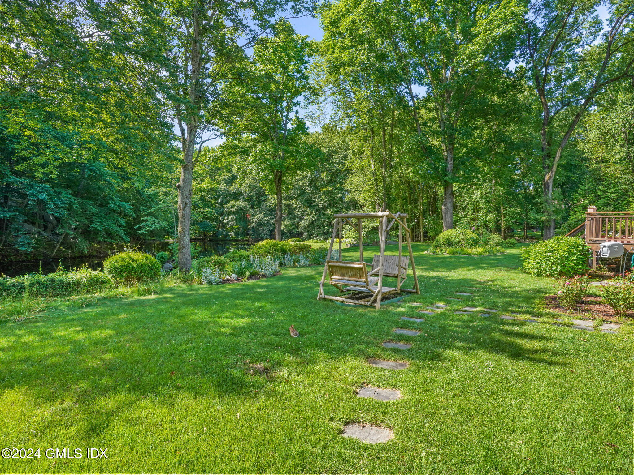 28 Dandy Drive Cos Cob, CT 06807 - Photo 31 of 35 a view of a park with wooden fence and bench