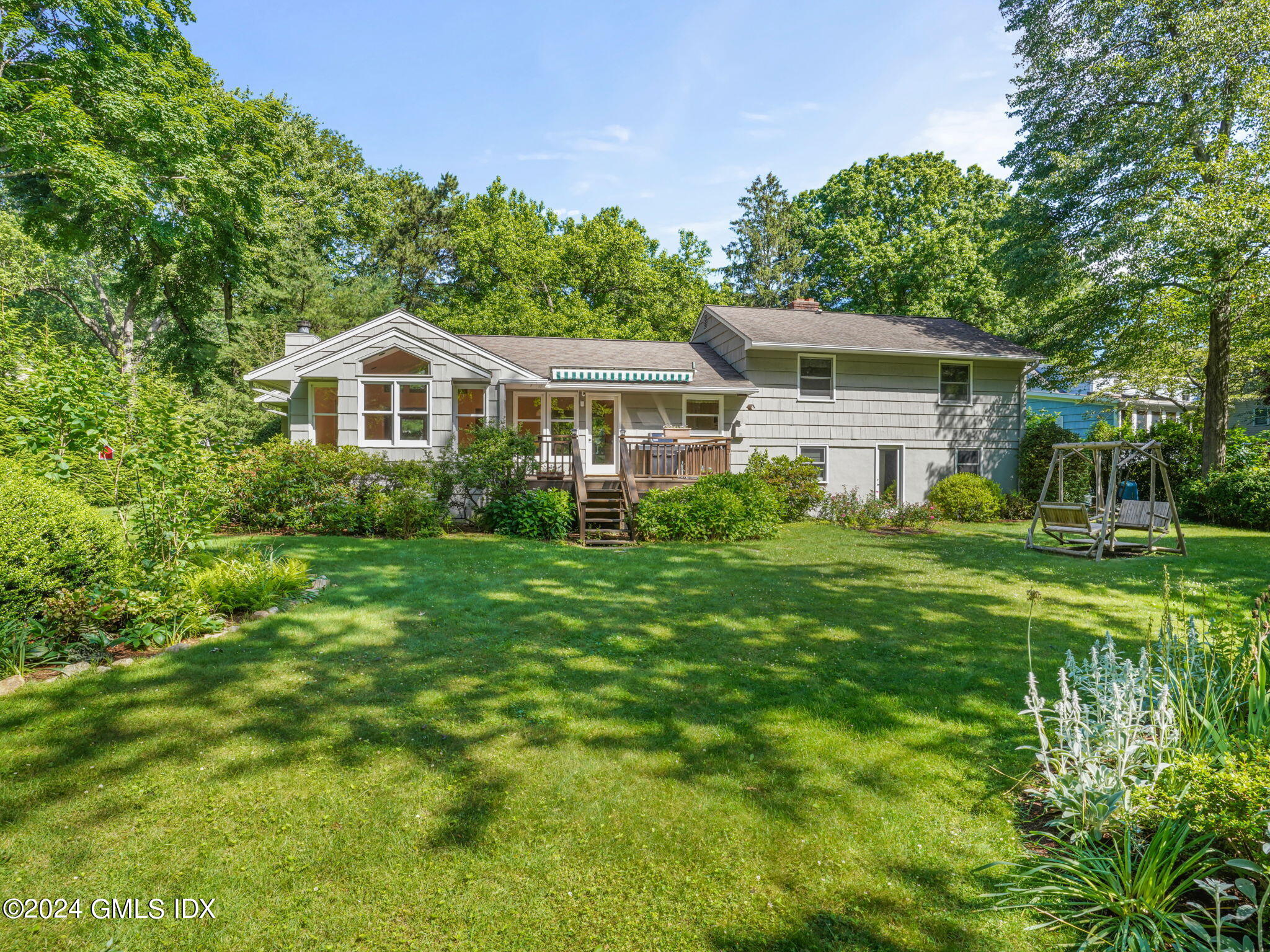 28 Dandy Drive Cos Cob, CT 06807 - Photo 32 of 35 a front view of a house with a garden