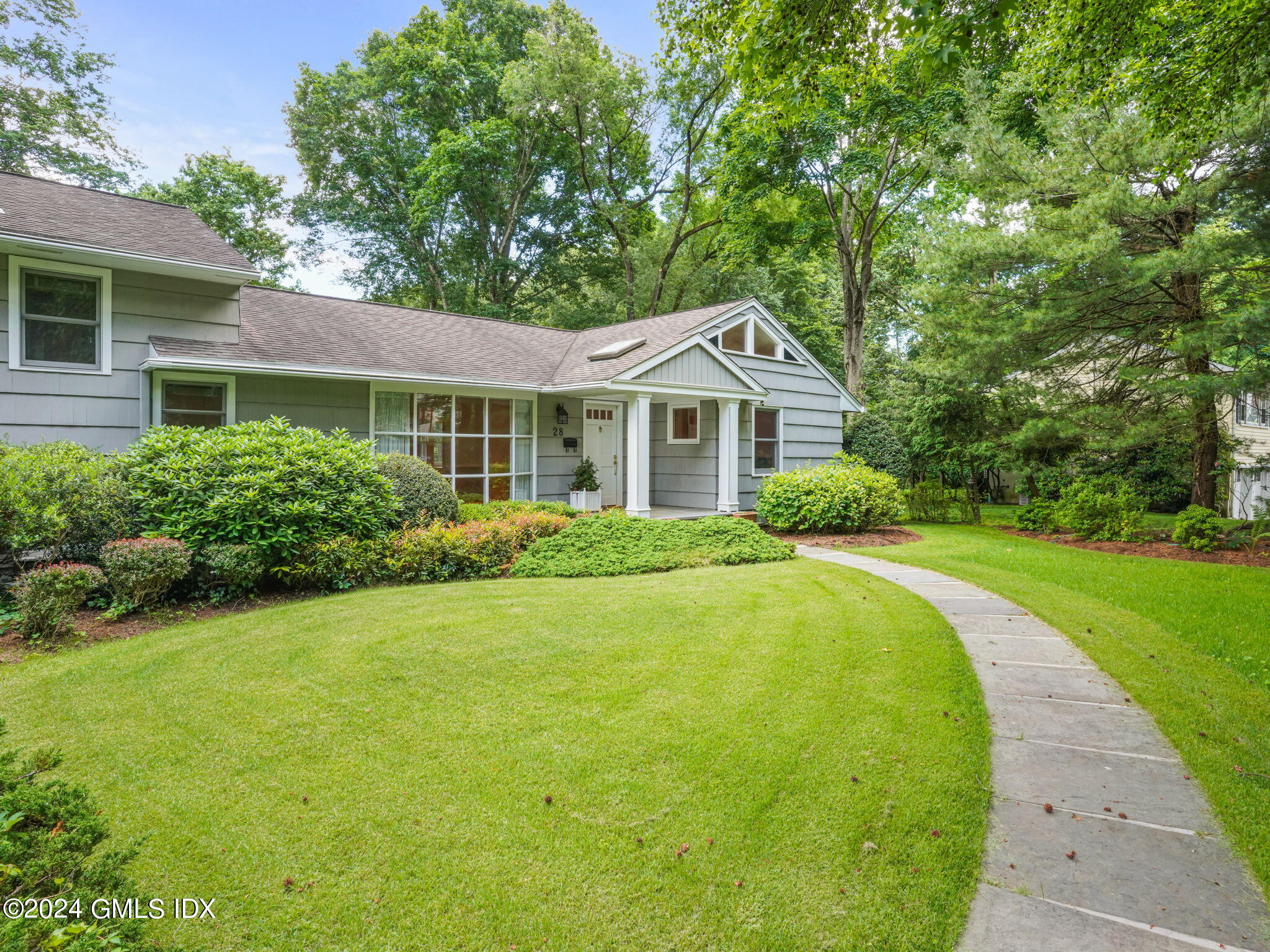 28 Dandy Drive Cos Cob, CT 06807 - Photo 33 of 35 a front view of a house with yard and green space