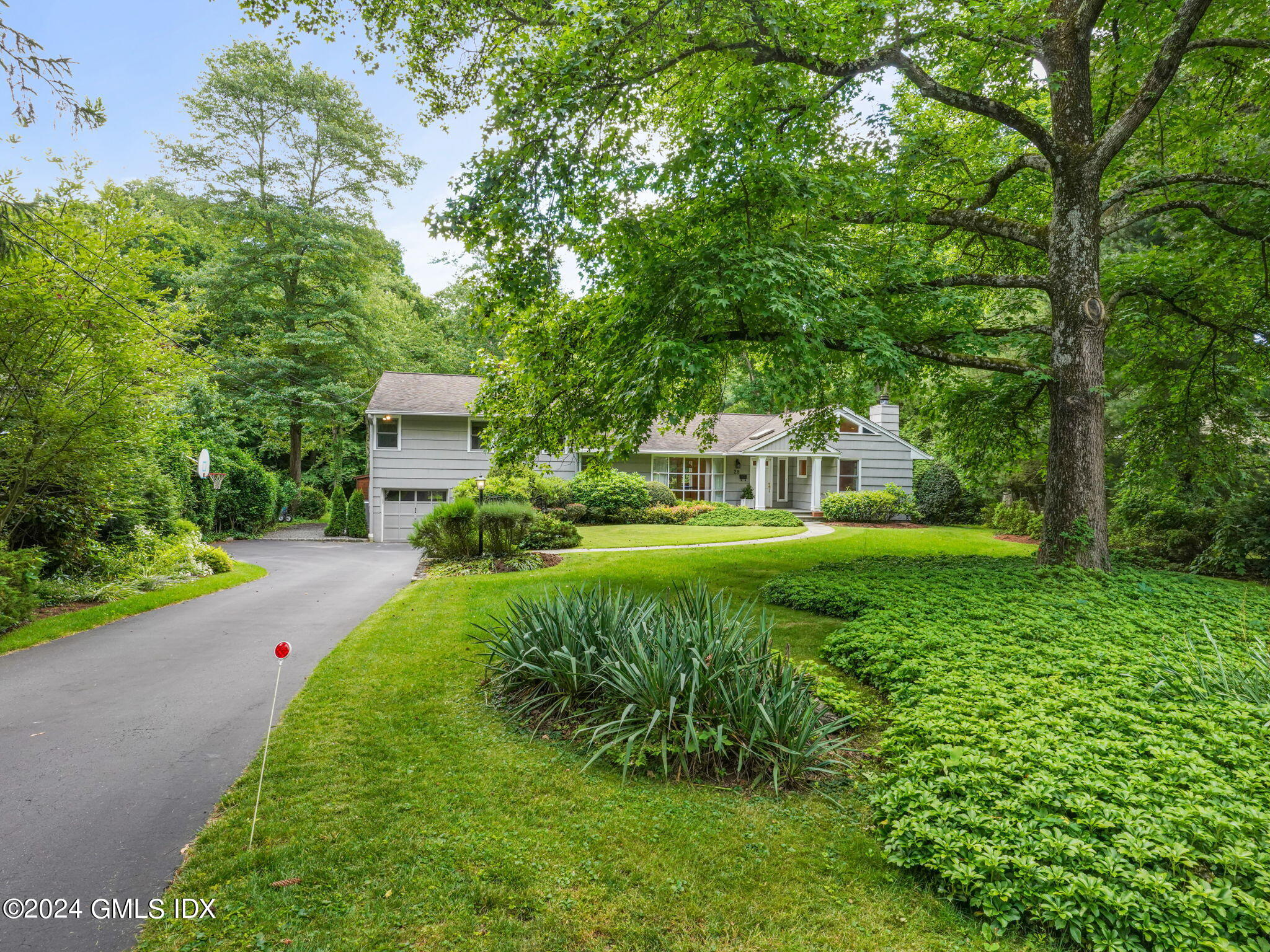 28 Dandy Drive Cos Cob, CT 06807 - Photo 34 of 35 a view of a house with a yard and sitting area