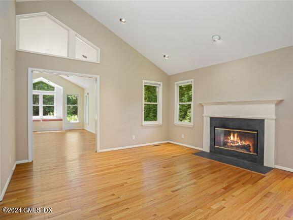 28 Dandy Drive Cos Cob, CT 06807 - Photo 4 of 35 a view of an empty room with window and fire place