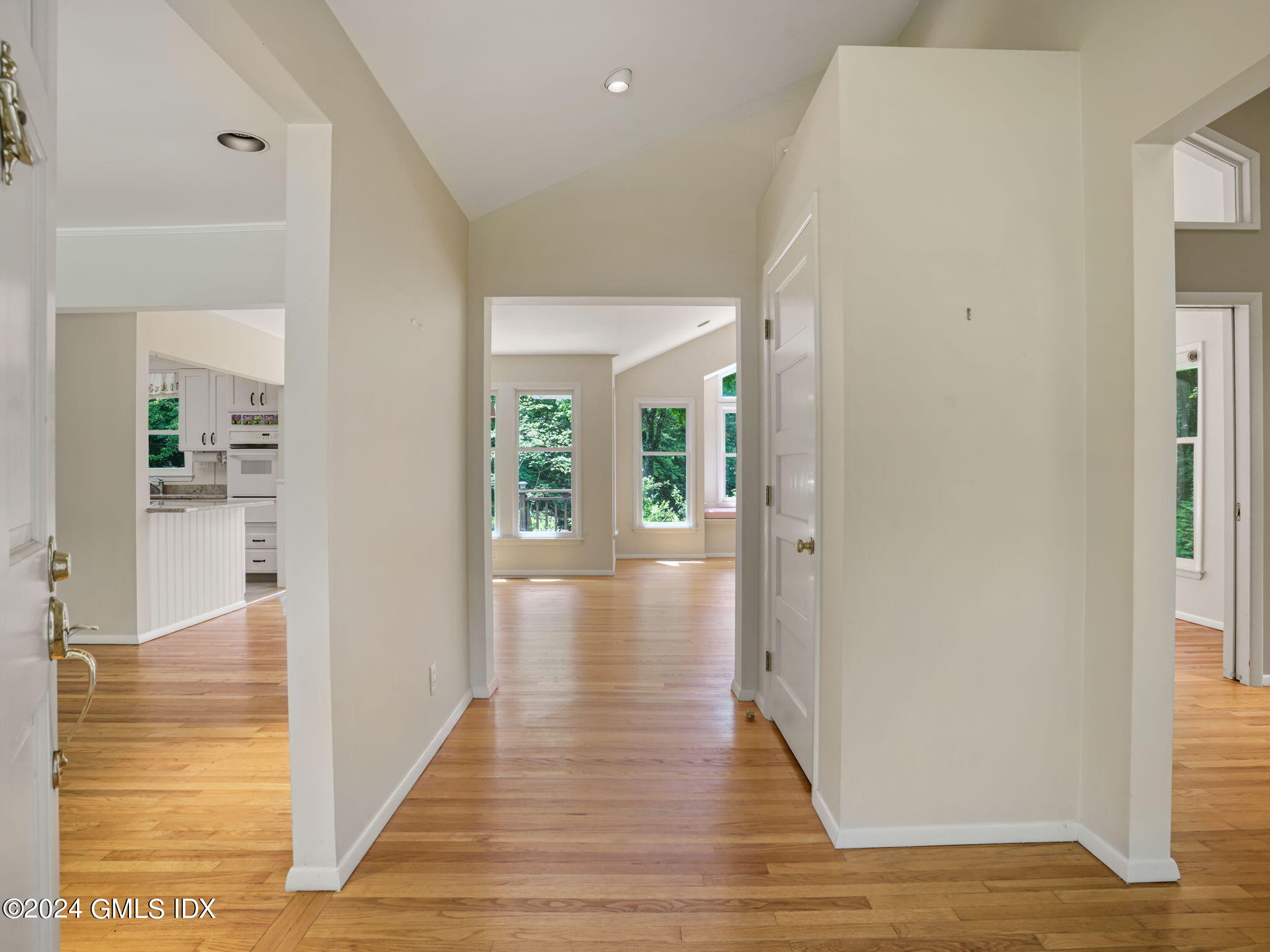 28 Dandy Drive Cos Cob, CT 06807 - Photo 5 of 35 wooden floor in a hall with an entryway