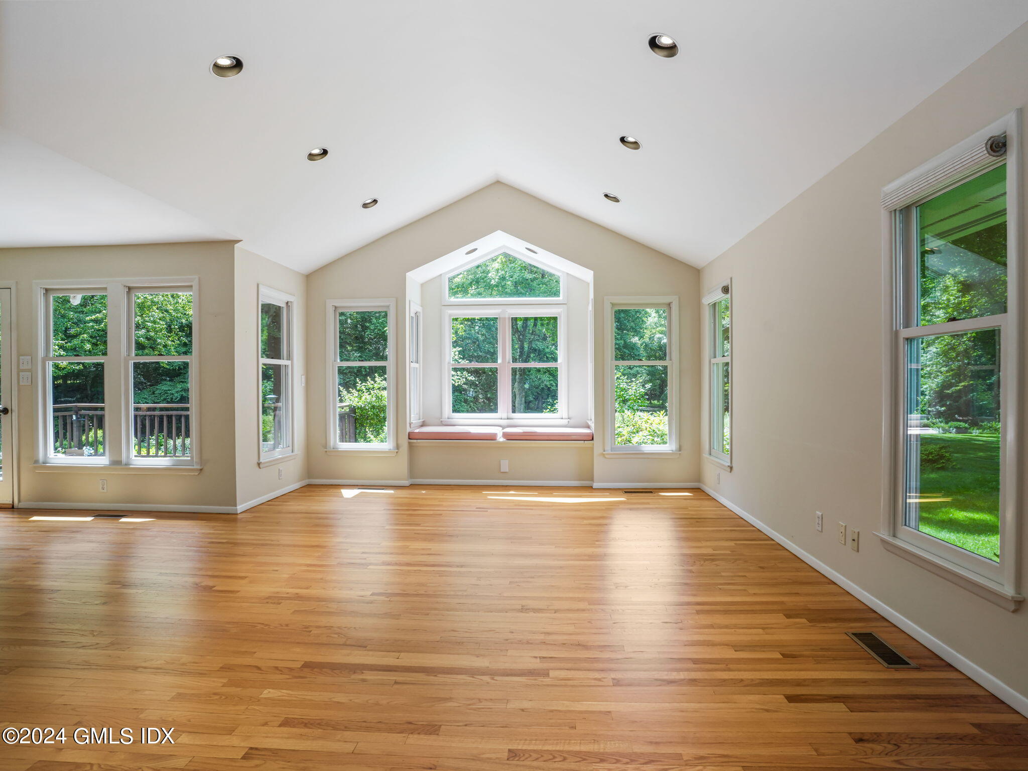 28 Dandy Drive Cos Cob, CT 06807 - Photo 6 of 35 a view of an empty room with wooden floor and a window