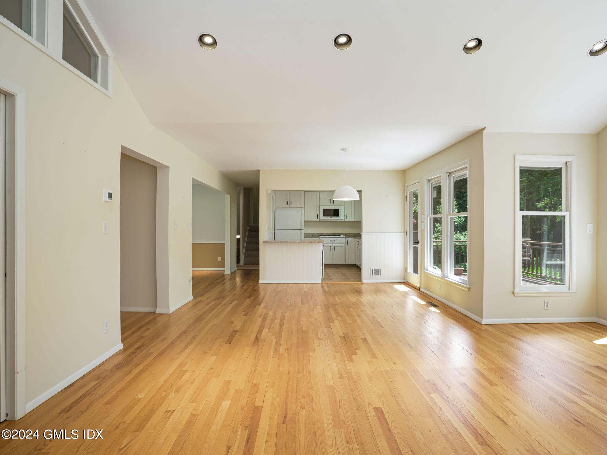 28 Dandy Drive Cos Cob, CT 06807 - Photo 8 of 35 a view of an empty room with wooden floor and a window