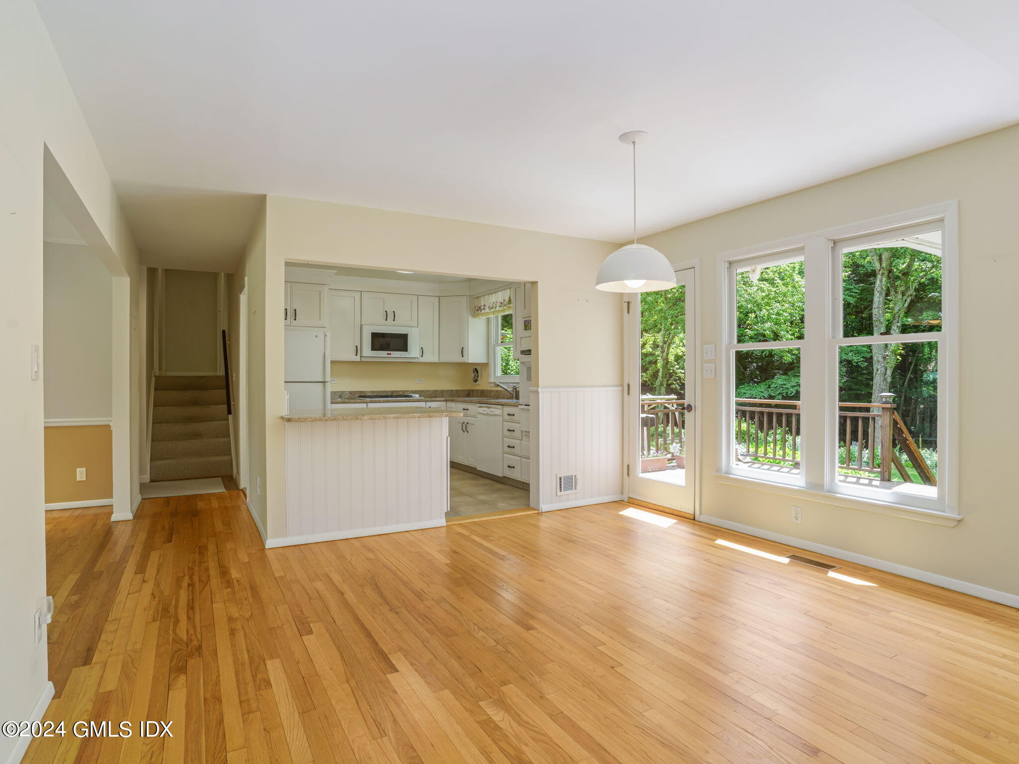28 Dandy Drive Cos Cob, CT 06807 - Photo 9 of 35 a view of an empty room with a kitchen and window