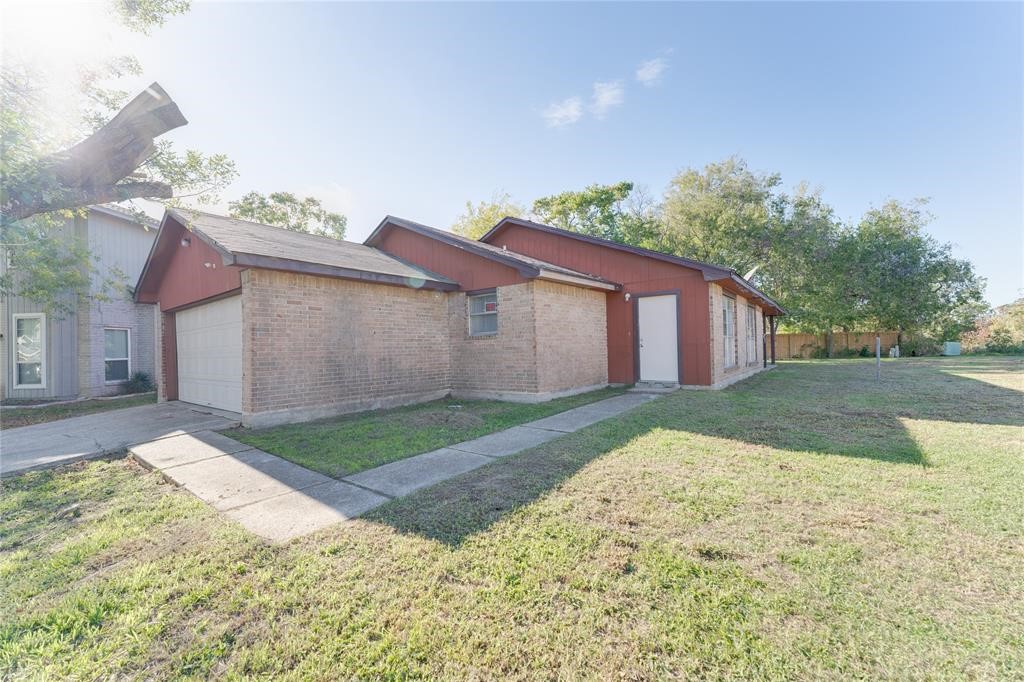 1539 Stevenage Lane Channelview, TX 77530 - Photo 15 of 15 a view of a house with a yard and large tree