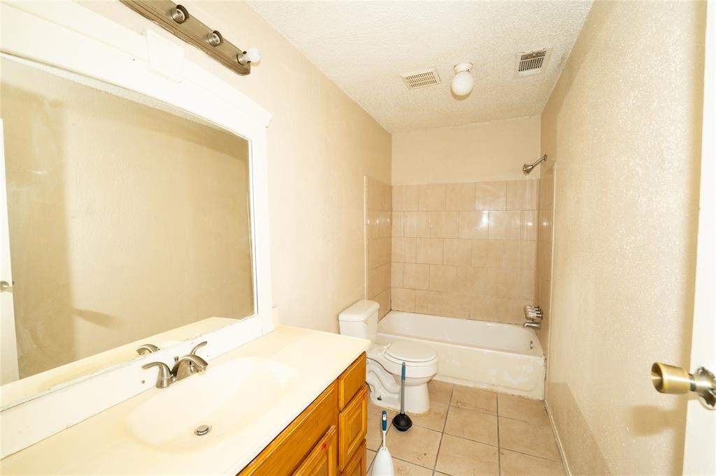 1539 Stevenage Lane Channelview, TX 77530 - Photo 9 of 15 a bathroom with a sink a toilet and shower
