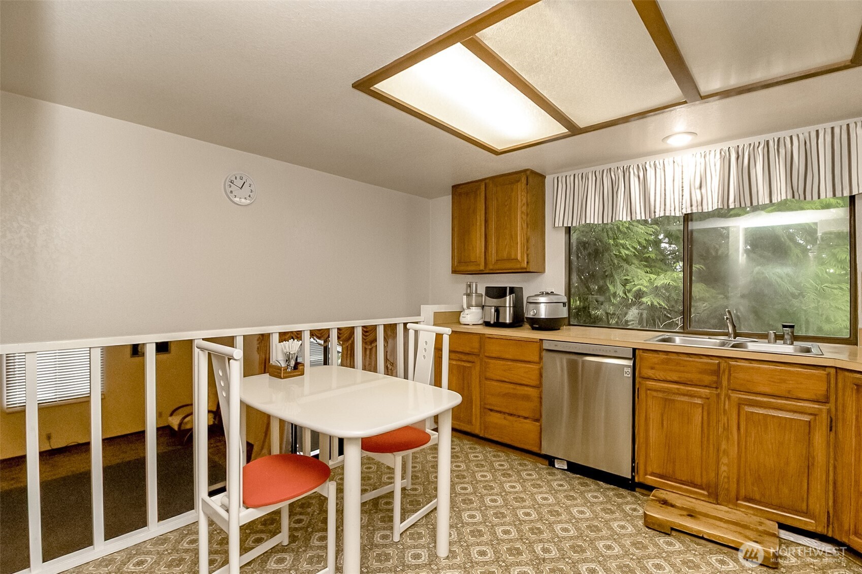 22121 4th Avenue Southeast Bothell, WA 98021 - Photo 7 of 22 a kitchen with a dining table chairs sink and cabinets