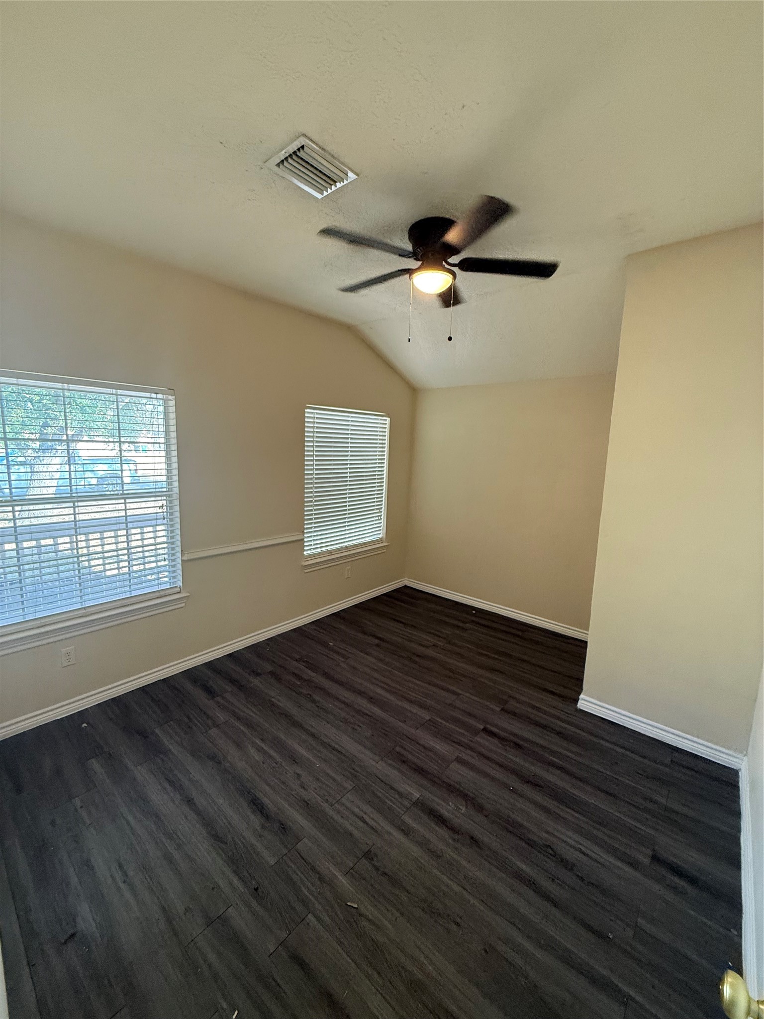 10918 Jutland Road Houston, TX 77048 - Photo 11 of 11 a view of an empty room with wooden floor and a window
