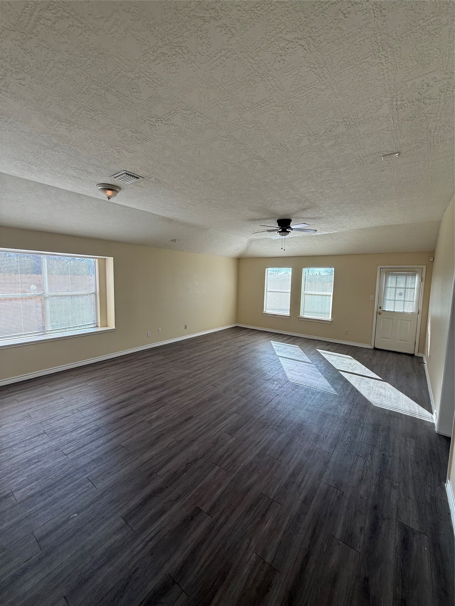 10918 Jutland Road Houston, TX 77048 - Photo 3 of 11 a view of empty room with wooden floor and fan