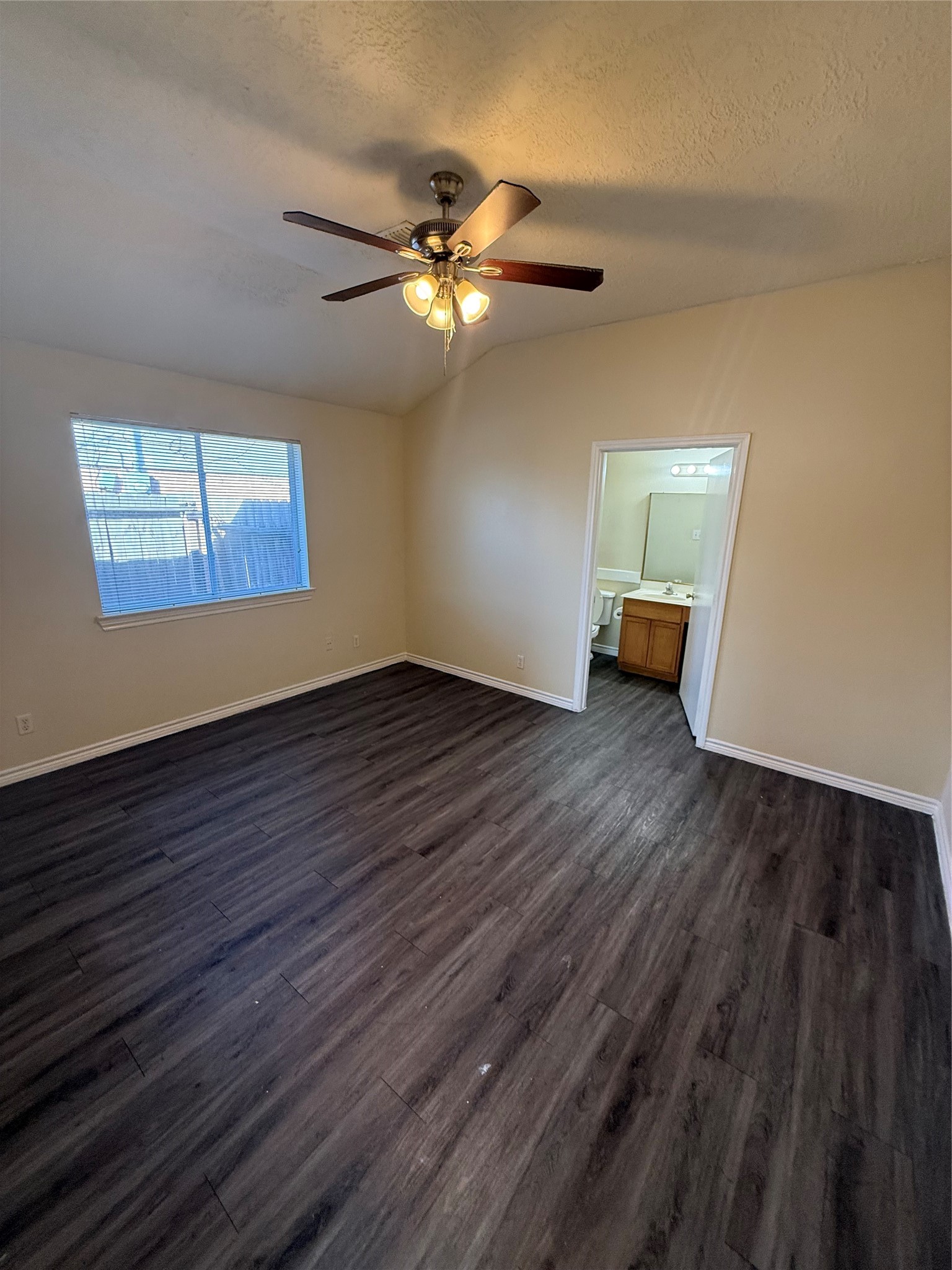 10918 Jutland Road Houston, TX 77048 - Photo 5 of 11 a view of an empty room with wooden floor and a window