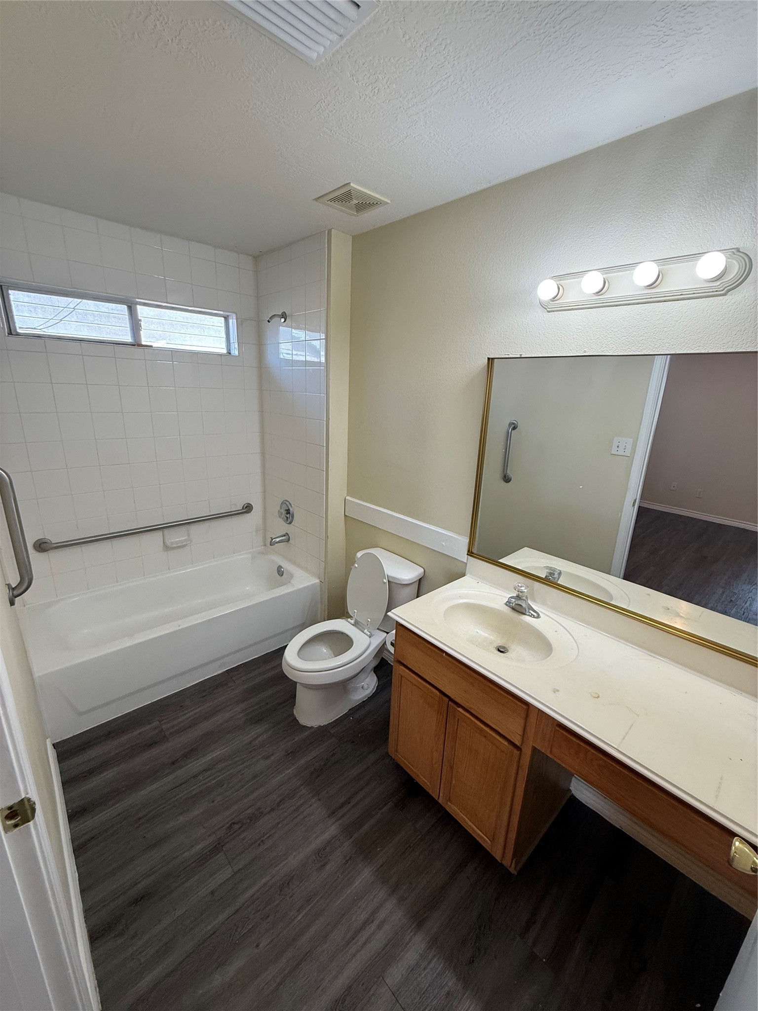 10918 Jutland Road Houston, TX 77048 - Photo 6 of 11 a bathroom with a sink a toilet and a bathtub