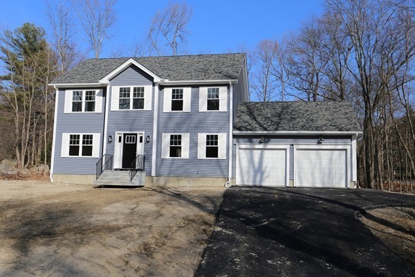 1 Fox Hill Road Ashland, MA 01721 - Photo 1 of 15 a front view of a house with a yard