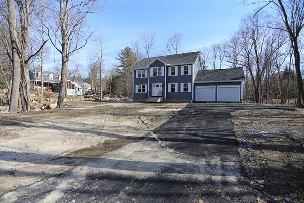 1 Fox Hill Road Ashland, MA 01721 - Photo 15 of 15 a view of a house with a yard covered in snow