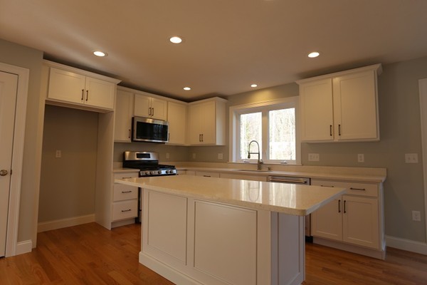 1 Fox Hill Road Ashland, MA 01721 - Photo 4 of 15 a kitchen with stainless steel appliances granite countertop a stove a sink and a refrigerator